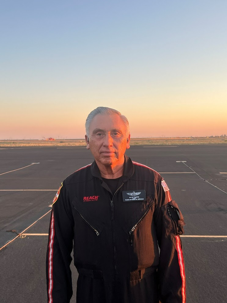 Emergency medical services worker Dan Laguna, of Salt Lake City, stands at an airfield before work. Laguna will be rewarded a Star of Life for extraordinary service.