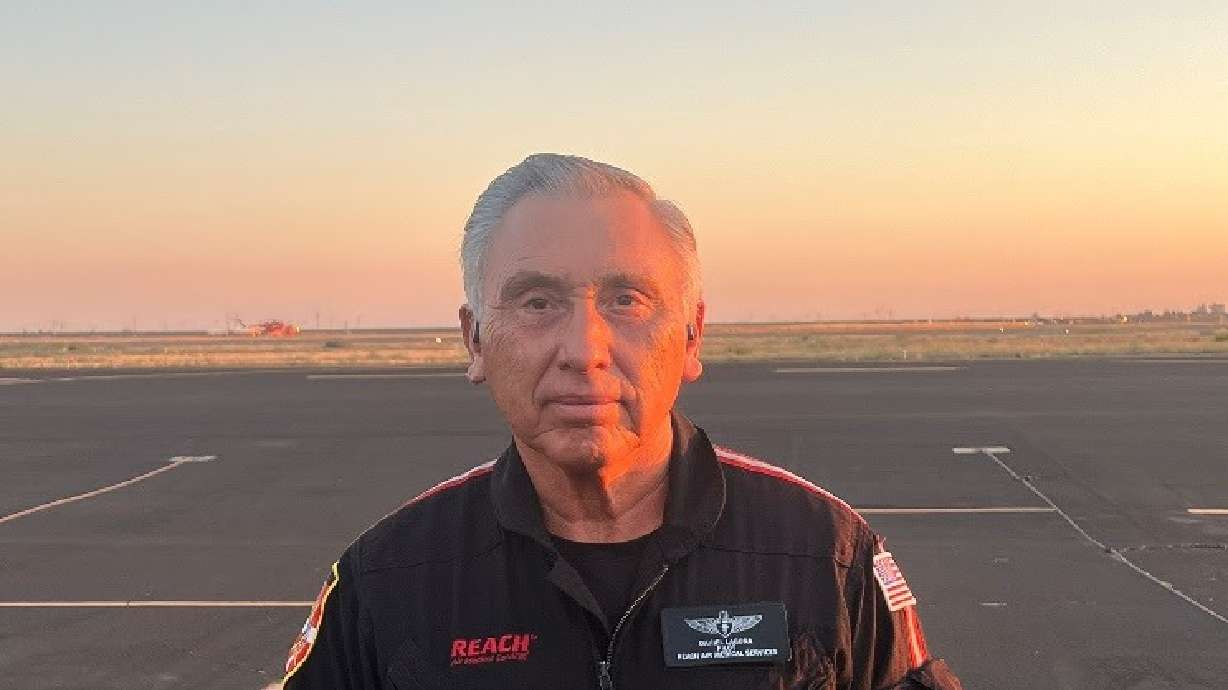 Emergency medical services worker Dan Laguna, of Salt Lake City, stands at an airfield before work. Laguna will be rewarded a Star of Life for extraordinary service.