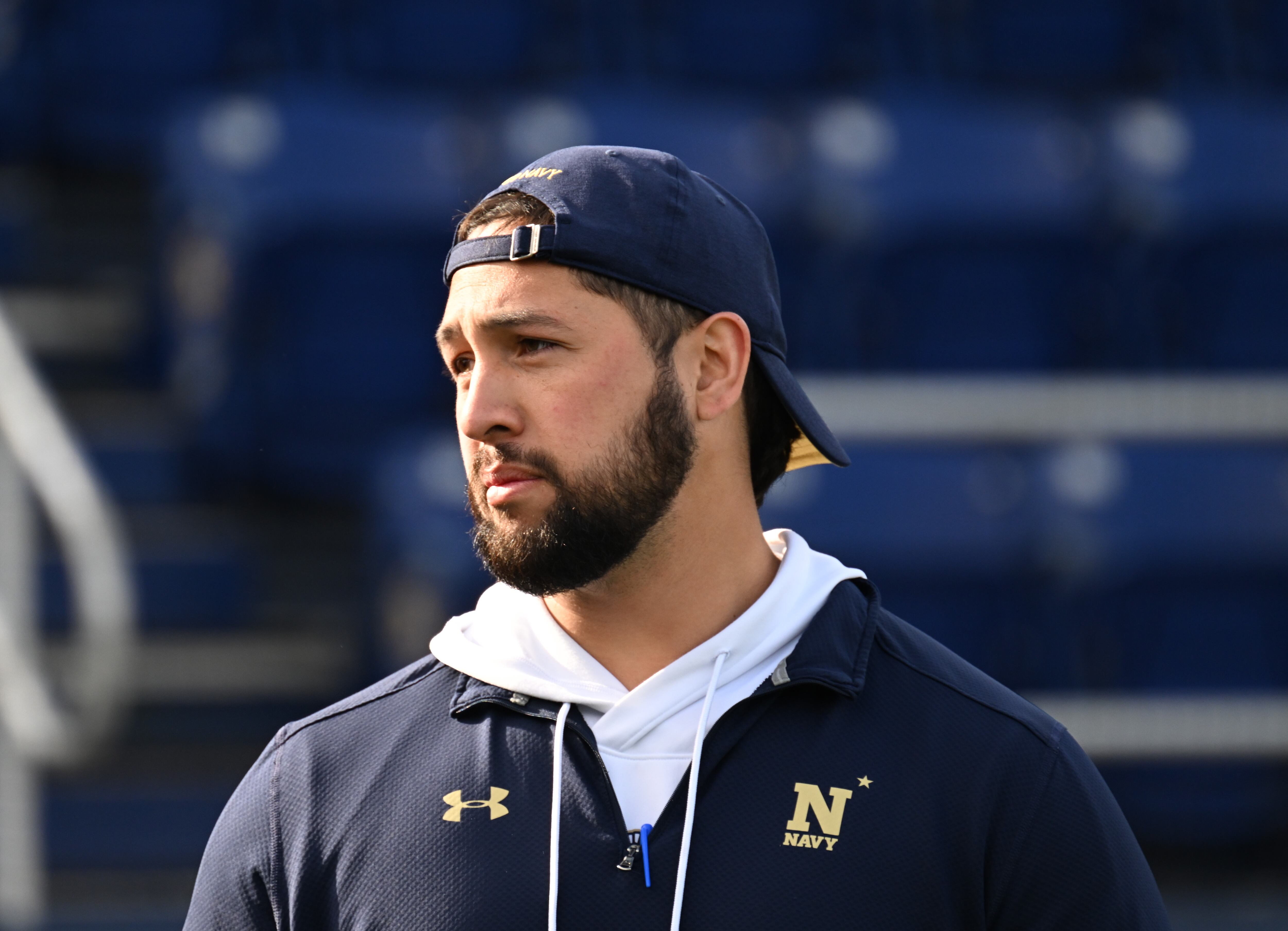 Defensive line coach and former BYU football player and returned missionary Va'a Niumatalolo patrols the sideline of a recent Navy football game. Niumatalolo's father, Ken Niumatalolo, was the head coach at Navy for many years.