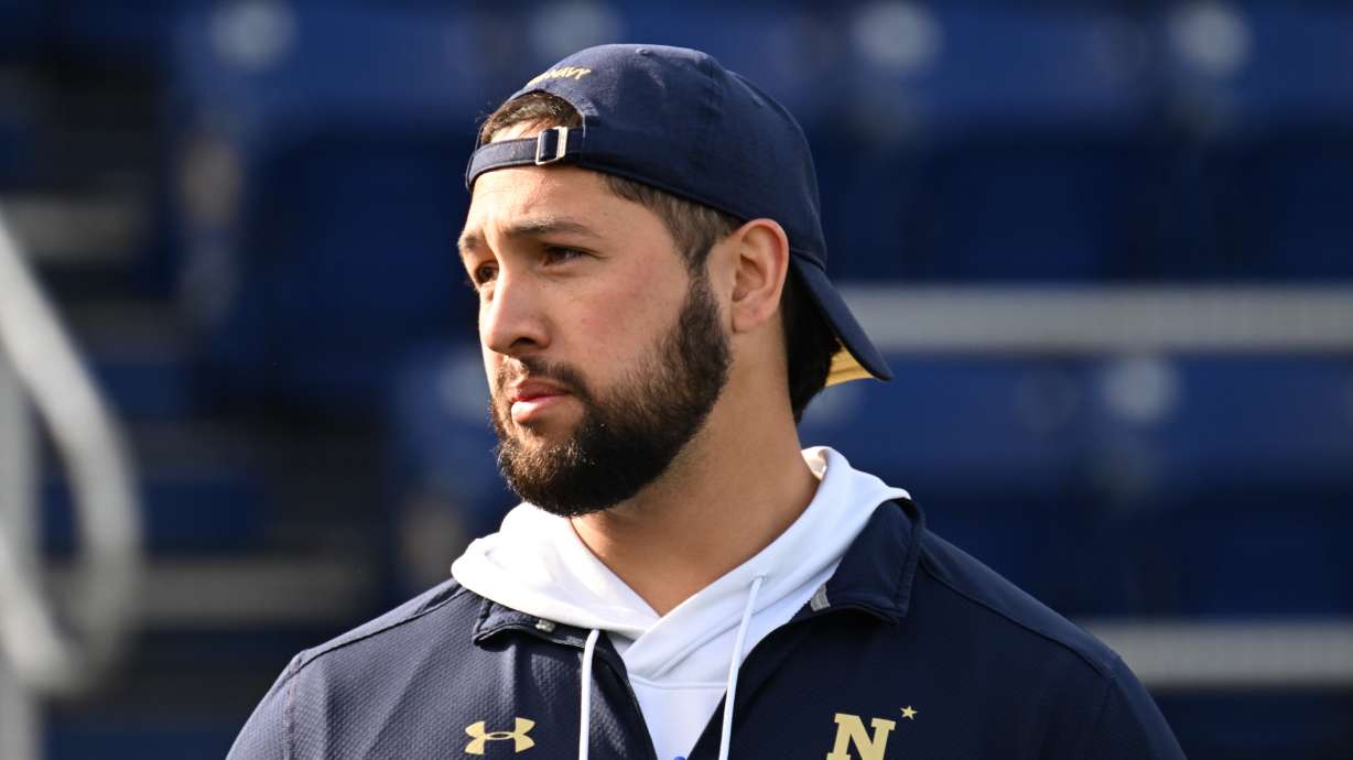 Defensive line coach and former BYU football player and returned missionary Va'a Niumatalolo patrols the sideline of a recent Navy football game. Niumatalolo's father, Ken Niumatalolo, was the head coach at Navy for many years.