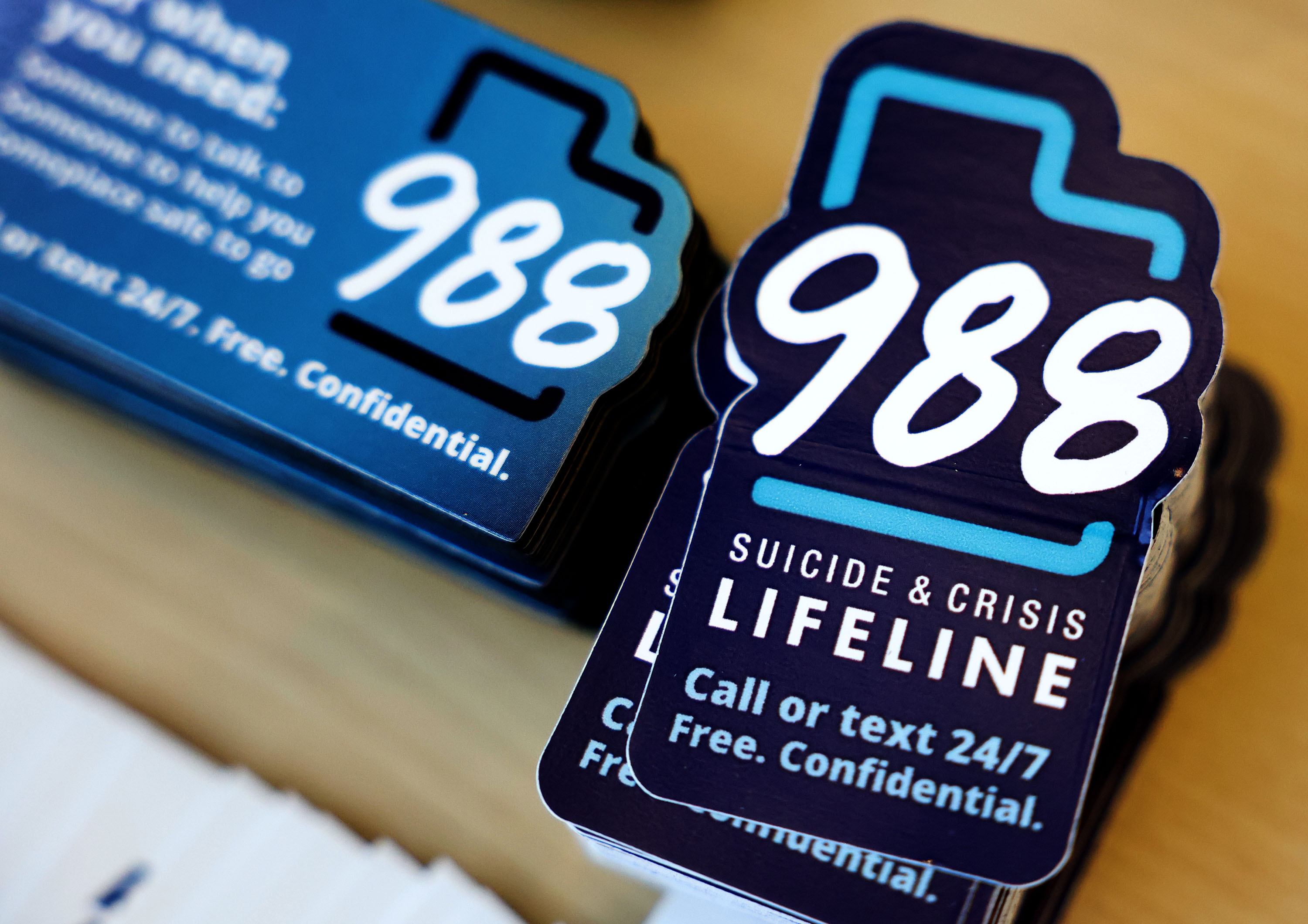 National 988 crisis lifeline stickers are pictured in Salt Lake City on Sept. 5. Utah's behavioral health system lacks a central oversight authority and does not have a strategic plan to reform the system, according to a legislative audit released Tuesday.