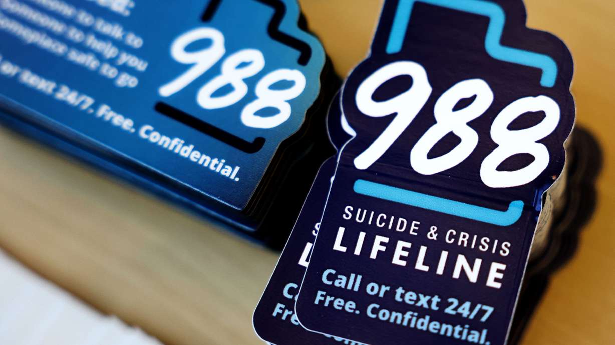 National 988 crisis lifeline stickers are pictured in Salt Lake City on Sept. 5. Utah's behavioral health system lacks a central oversight authority and does not have a strategic plan to reform the system, according to a legislative audit released Tuesday.