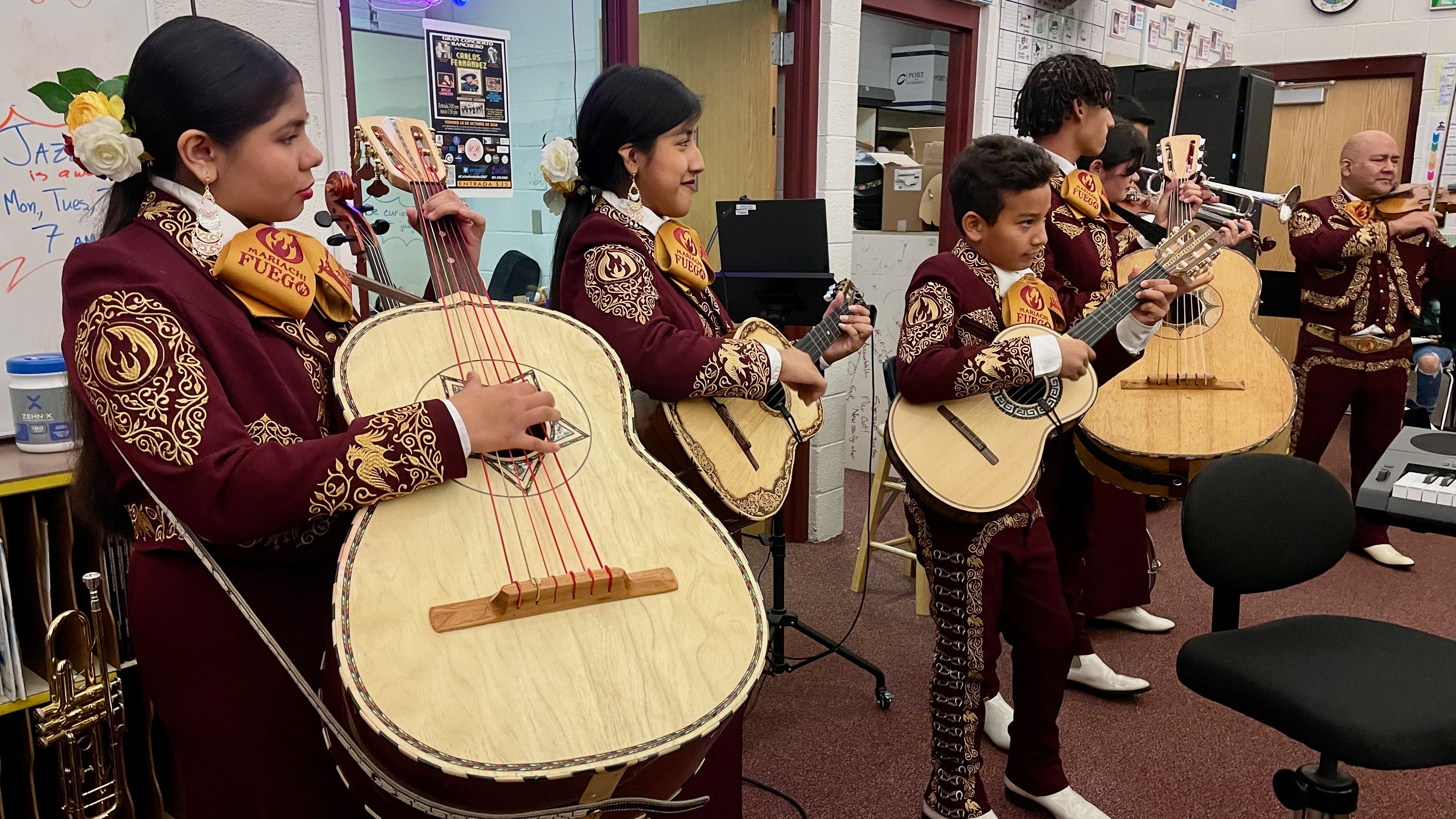 Members of Mariachi Fuego de Utah at a gathering with members of the mariachi class at Jefferson Junior High School in Kearns on Wednesday.