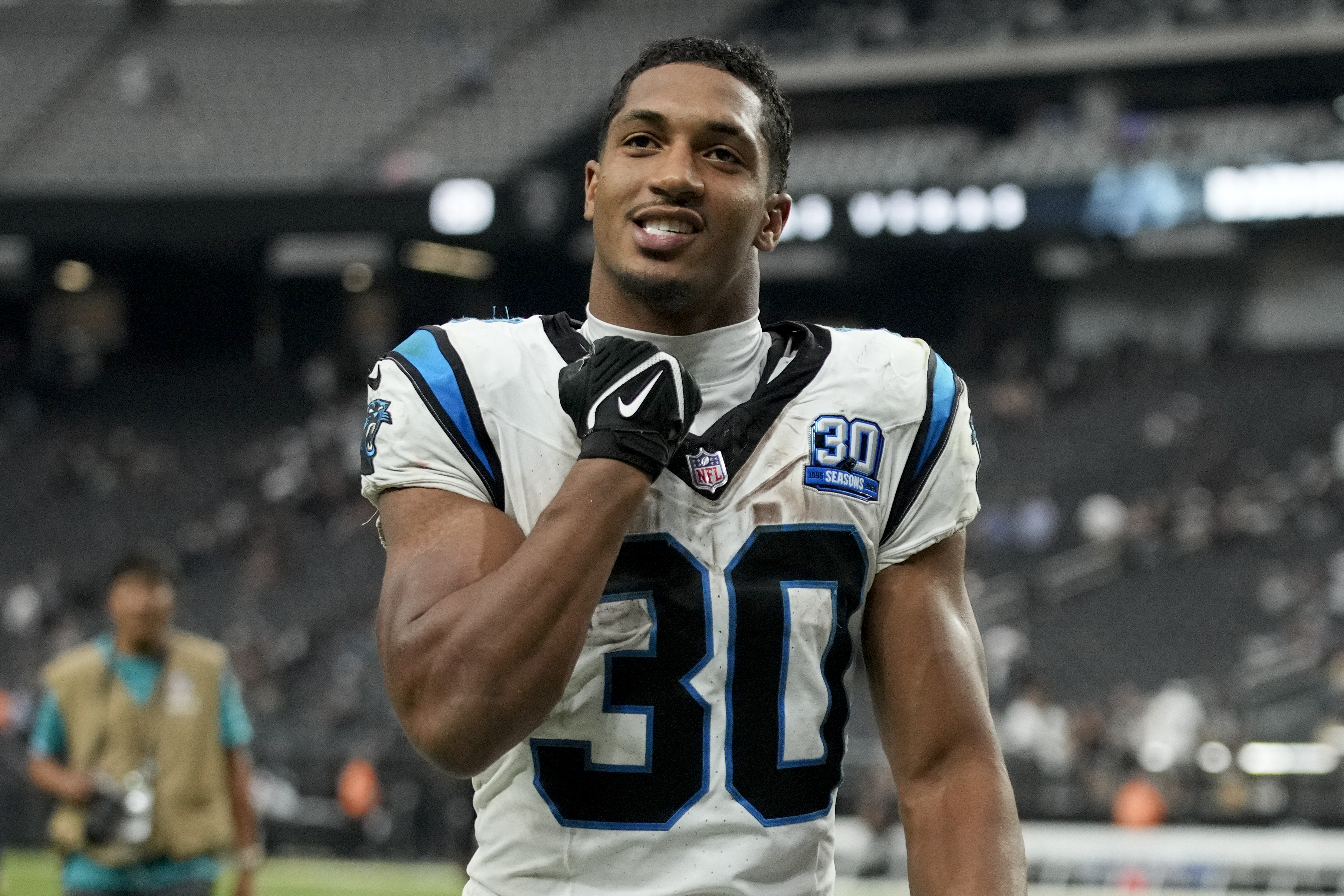 Carolina Panthers running back Chuba Hubbard celebrates after their win against the Las Vegas Raiders in an NFL football game, Sunday, Sept. 22, 2024, in Las Vegas.