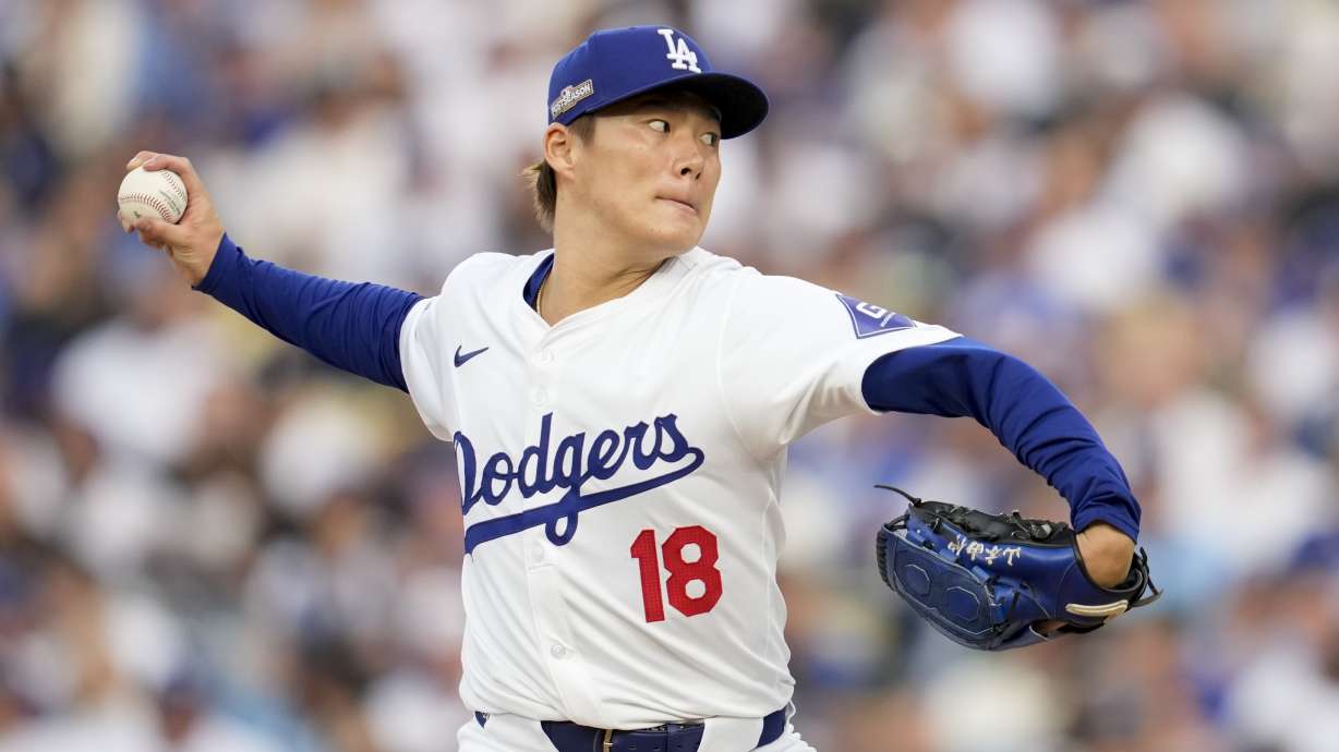 Los Angeles Dodgers starting pitcher Yoshinobu Yamamoto throws to a San Diego Padres batter during the second inning in Game 5 of a baseball NL Division Series Friday, Oct. 11, 2024, in Los Angeles.