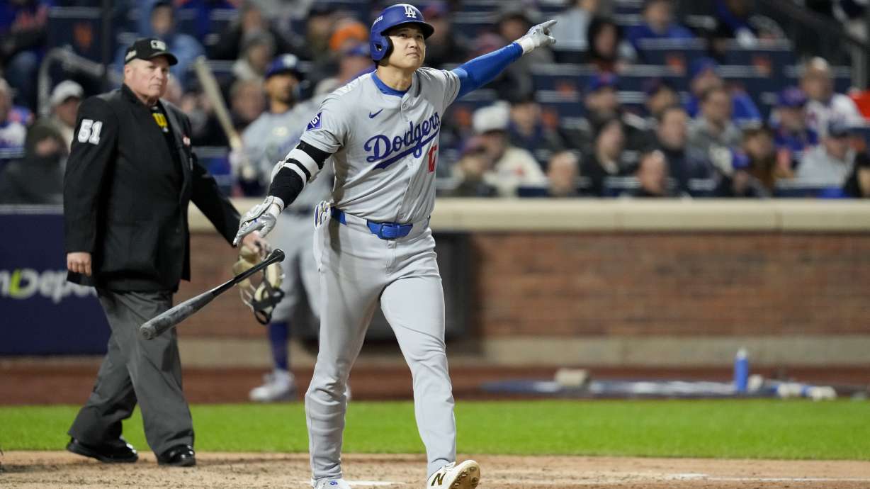 Los Angeles Dodgers' Shohei Ohtani celebrates his three-run home run against the New York Mets during the eighth inning in Game 3 of a baseball NL Championship Series, Wednesday, Oct. 16, 2024, in New York.