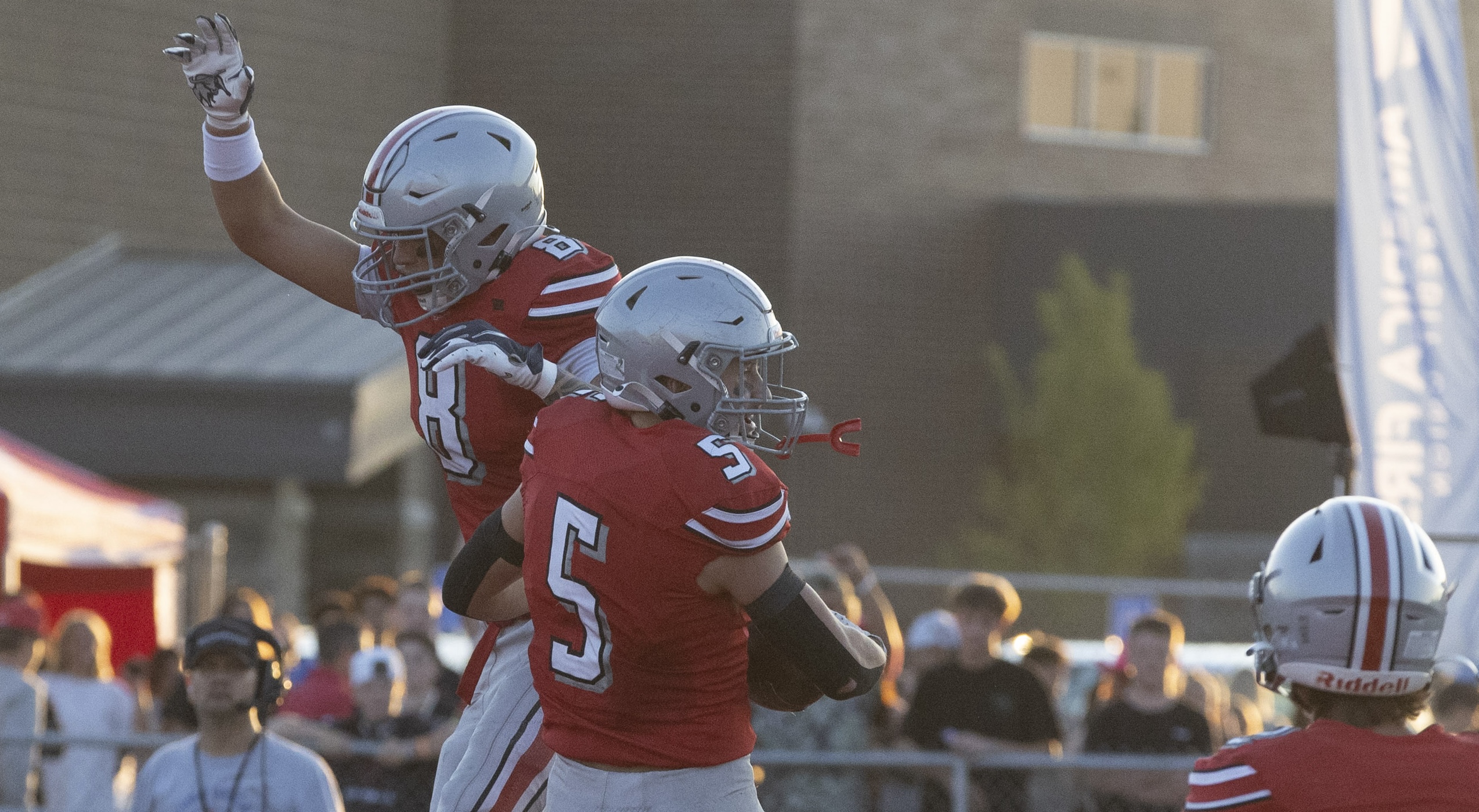 Spanish Fork’s Bronson Kalauli (8) and Kaden Vest (5) celebrate in the end zone after a touchdown by Vest during a game against Uintah at Spanish Fork High School in Spanish Fork on Thursday, Sept. 5, 2024.