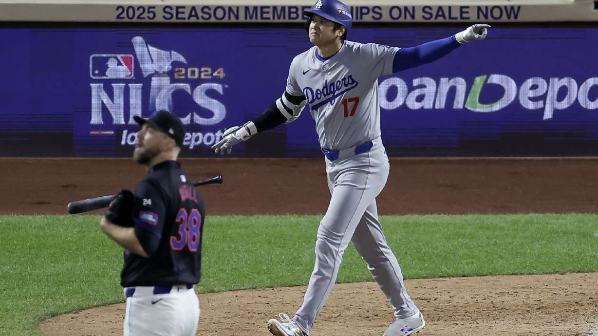 Los Angeles Dodgers' Shohei Ohtani celebrates his three-run home run against the New York Mets during the eighth inning in Game 3 of a baseball NL Championship Series, Wednesday, Oct. 16, 2024, in New York.