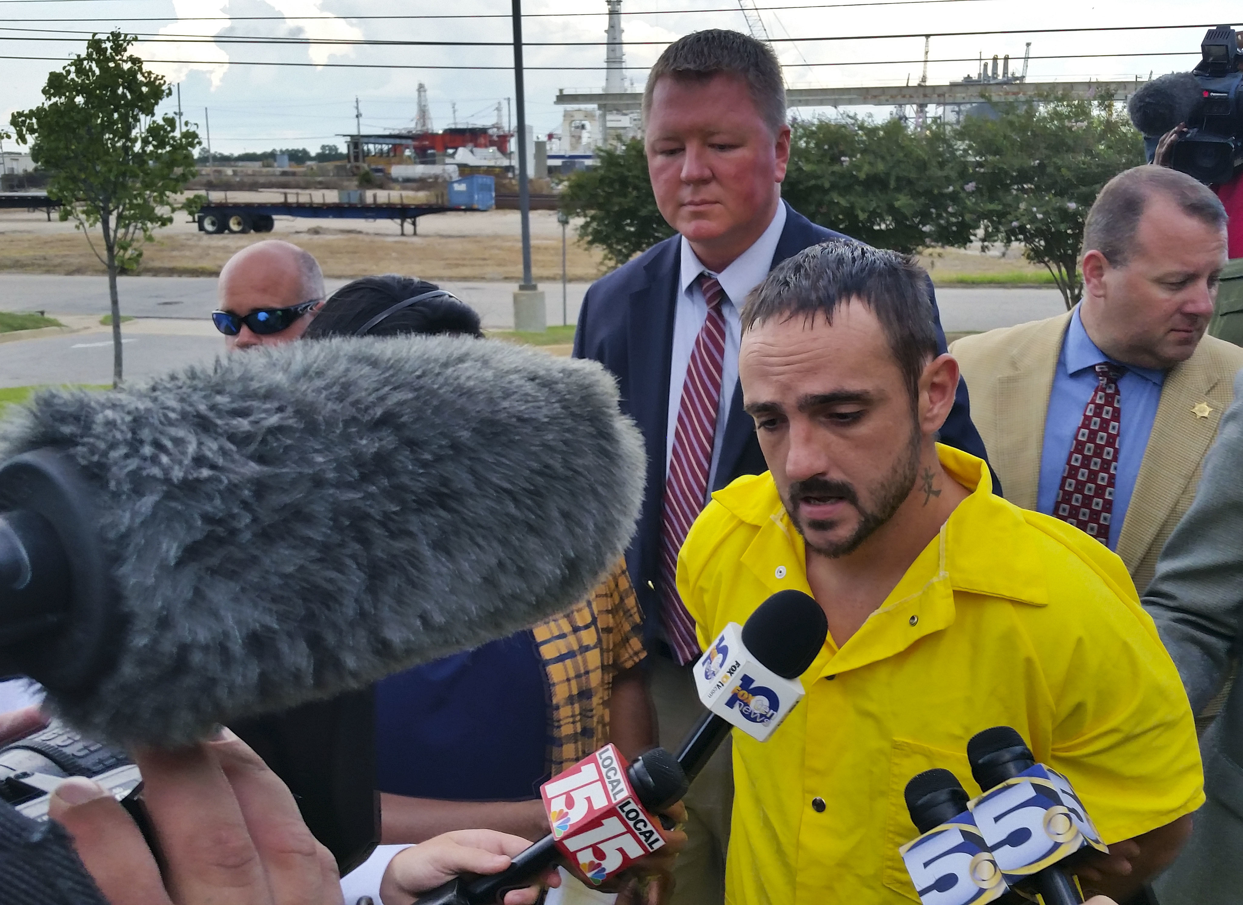 In this Aug. 22, 2016, photo, Derrick Dearman, 27, of Leakesville, Miss., center, is escorted into Mobile County Metro Jail in Mobile, Ala. Dearman was executed by lethal injection in Alabama Thursday. 