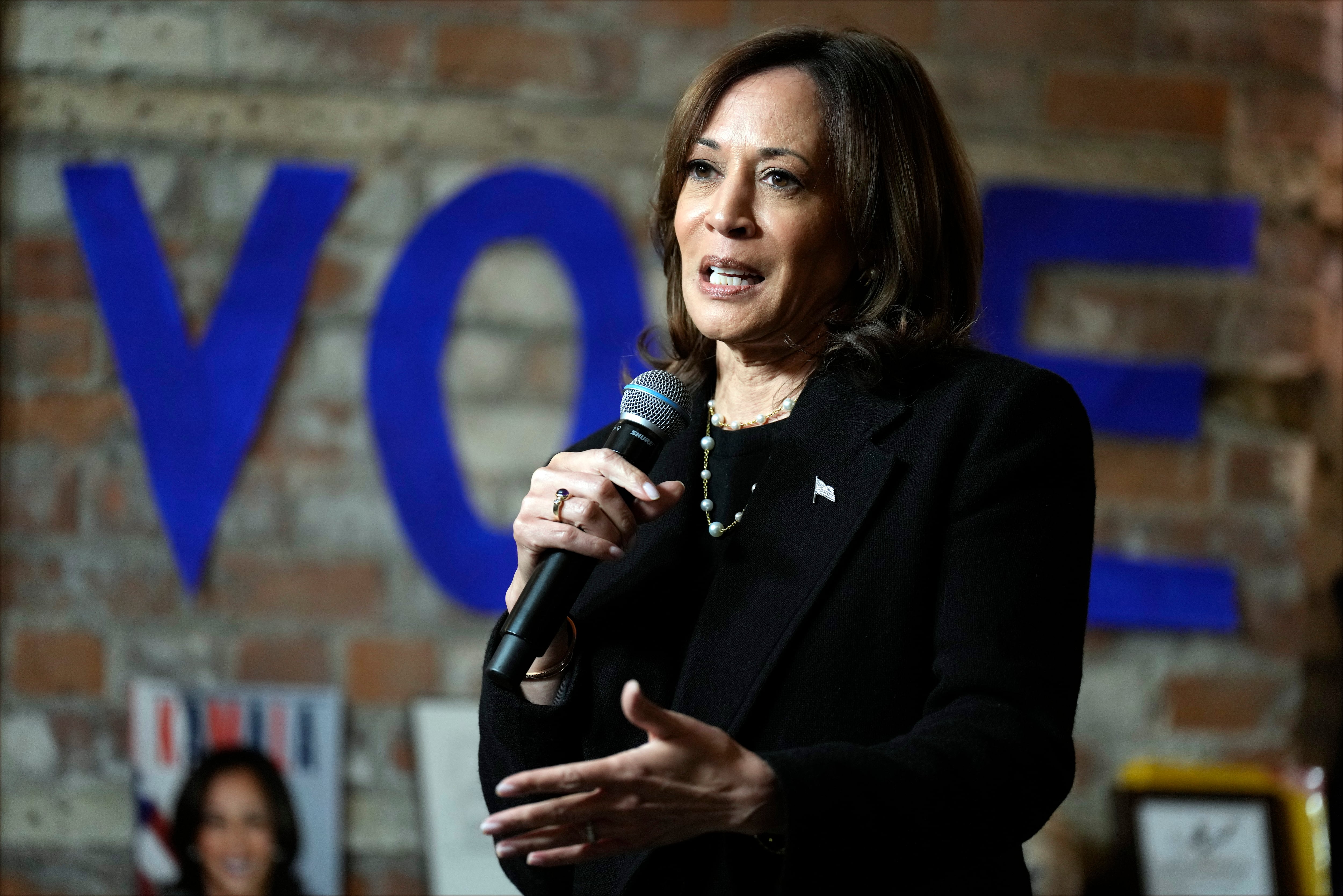 Democratic presidential nominee Vice President Kamala Harris speaks during a stop at Cred Cafe in Detroit, Tuesday. A new poll shows she holds a narrow lead over Donald Trump.