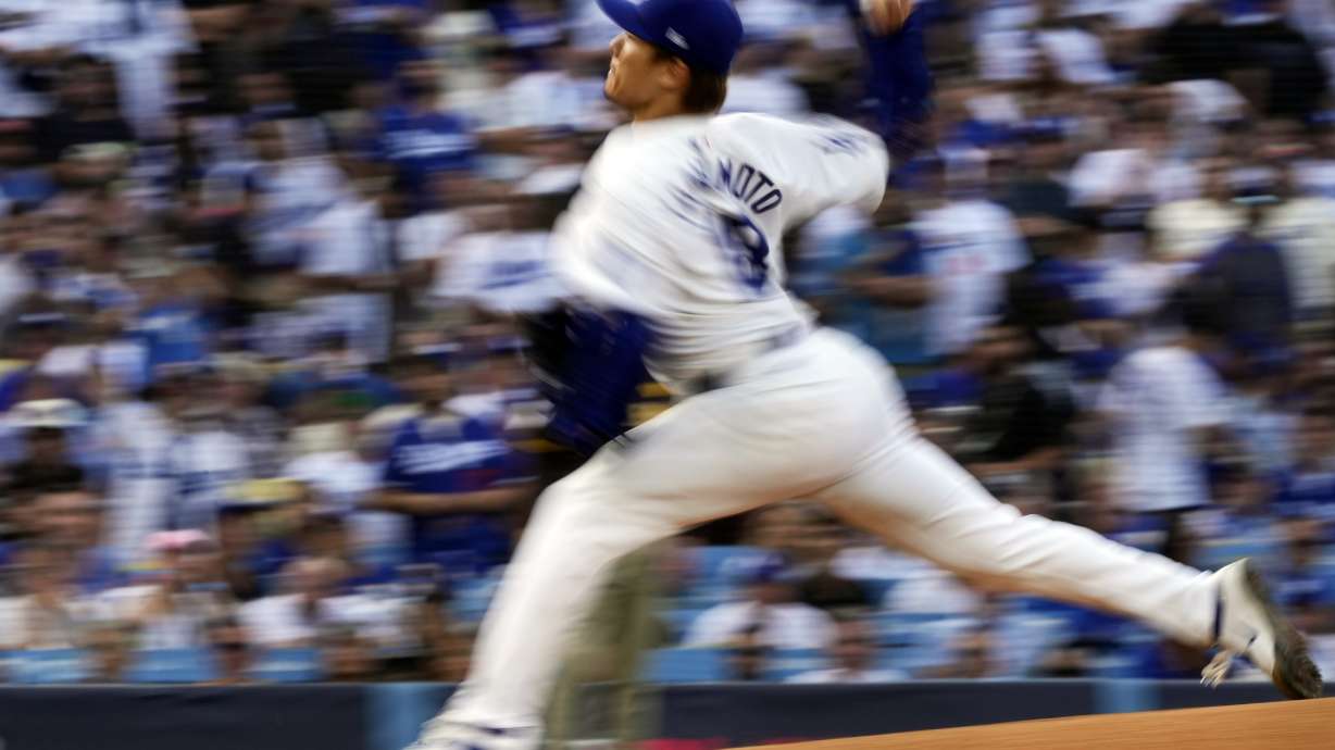 Los Angeles Dodgers starting pitcher Yoshinobu Yamamoto throws to a San Diego Padres batter during the first inning in Game 5 of a baseball NL Division Series Friday, Oct. 11, 2024, in Los Angeles.