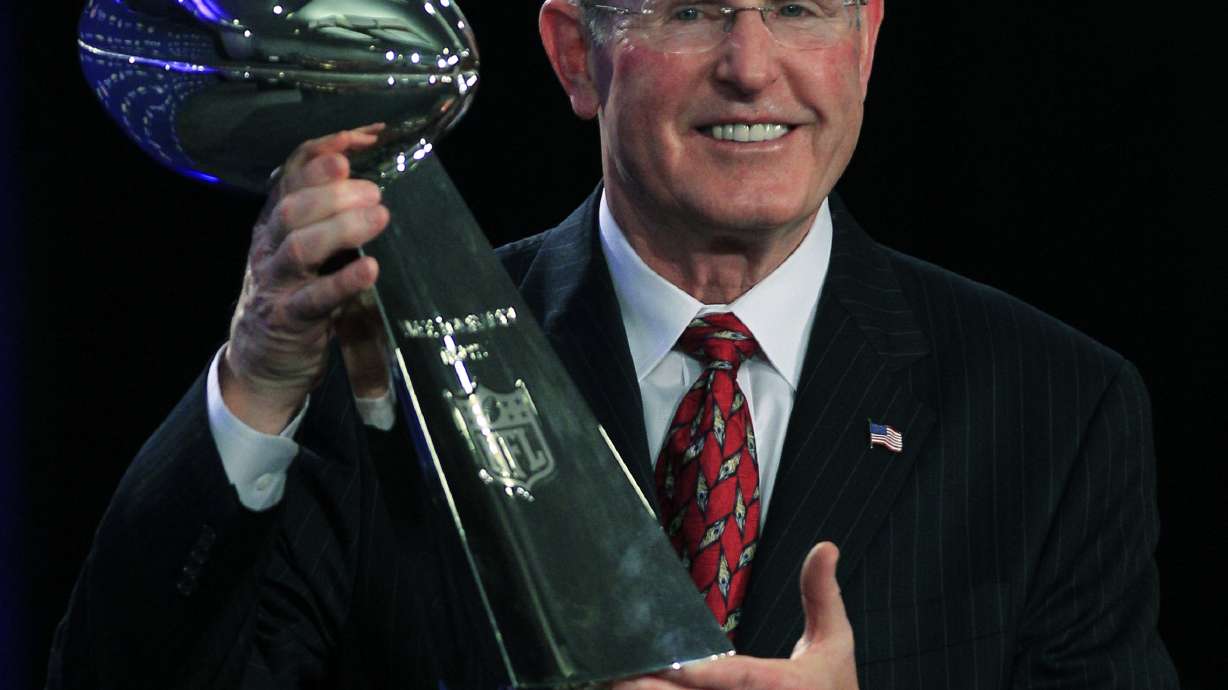 FILE - New York Giants head coach Tom Coughlin holds up the Vince Lombardi Trophy during a news conference after NFL football's Super Bowl XLVI in Indianapolis, Feb. 6, 2012.