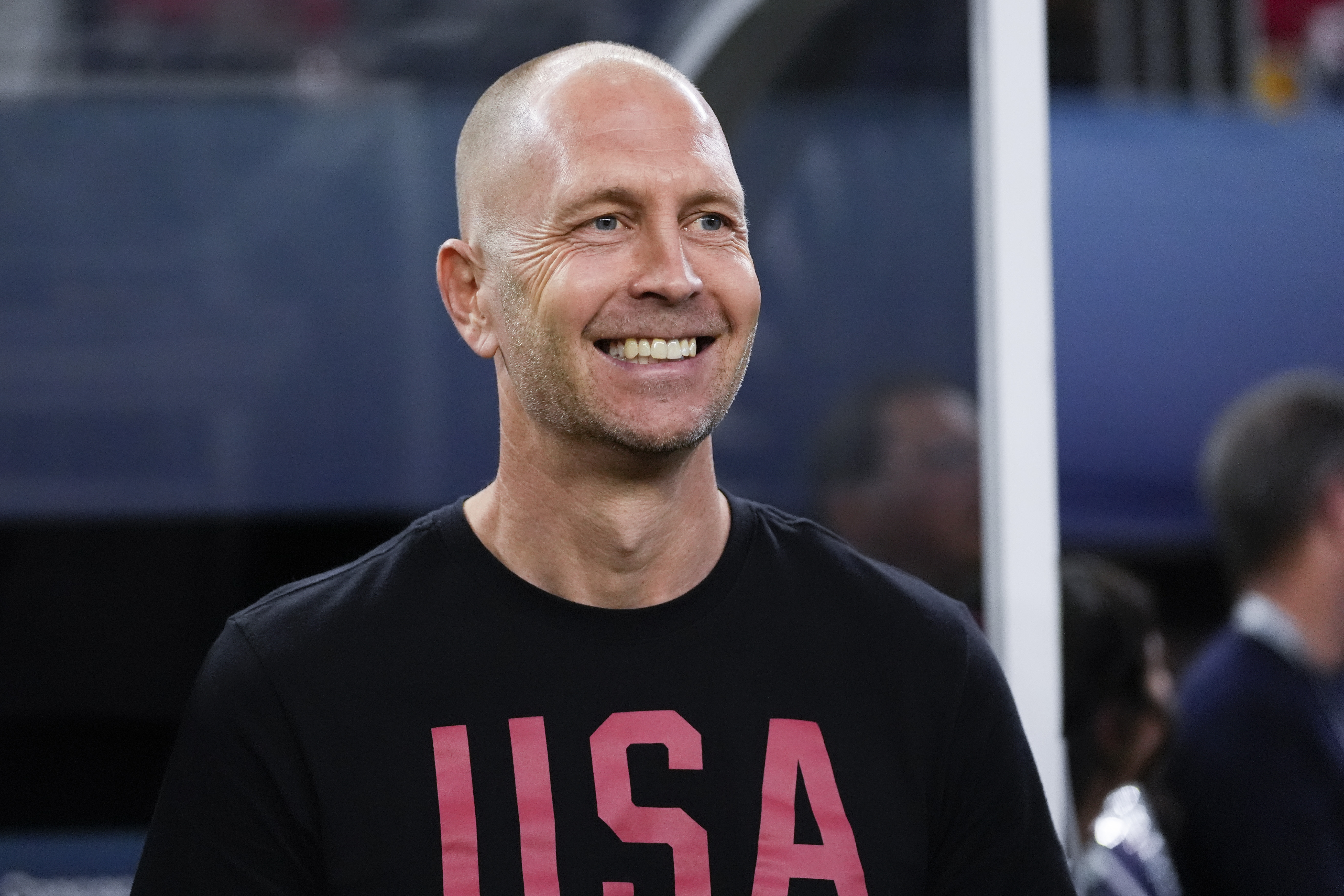 FILE - United States head coach Gregg Berhalter smiles from the bench before a CONCACAF Nations League final soccer match against Mexico, Sunday, March 24, 2024, in Arlington, Texas. 