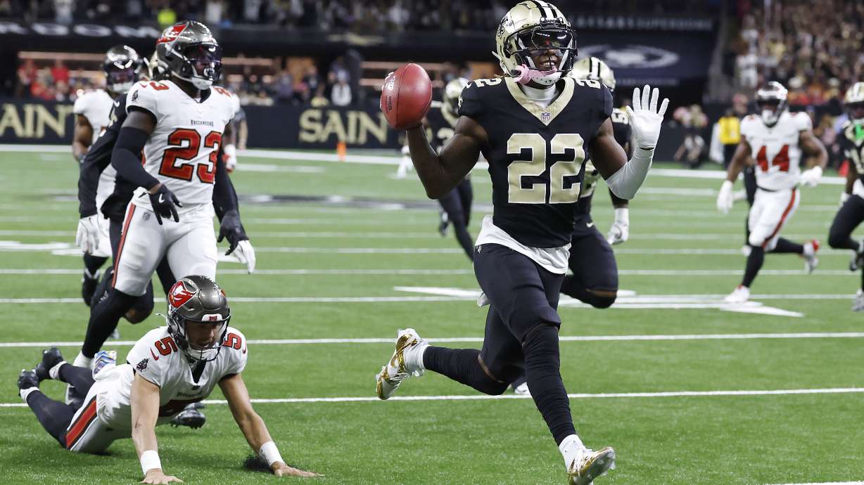 New Orleans Saints' Rashid Shaheed (22) gestures while returning a punt for a touchdown past Tampa Bay Buccaneers punter Jake Camarda (5) during the first half of an NFL football game in New Orleans, Sunday, Oct. 13, 2024.