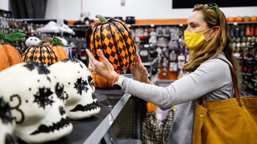 Valerie Hadley picks a Halloween pumpkin decoration at Zurchers in Salt Lake City on Oct. 16, 2020. A recent study found Utahns were putting up the most Halloween decorations of all 50 states in the U.S. 