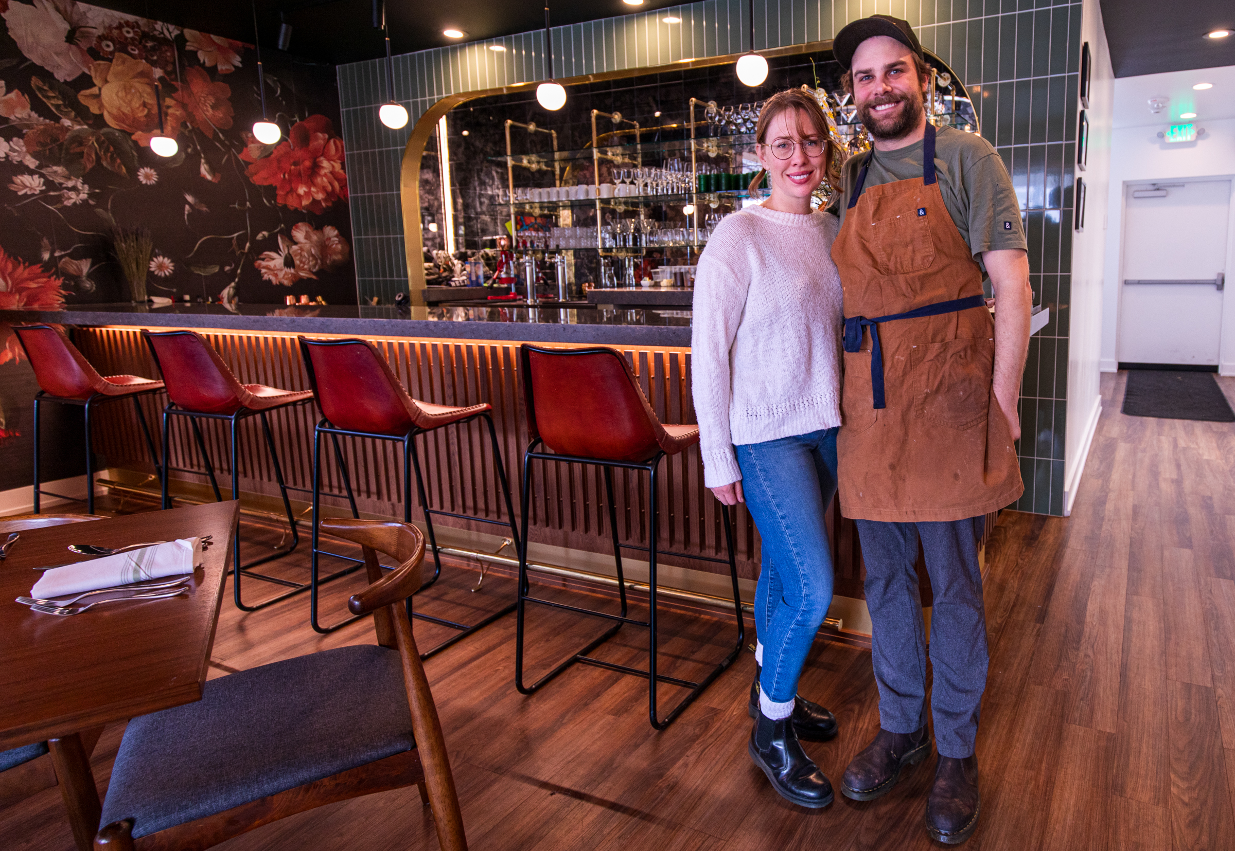 Adam and Kristen Cold, owners of Roux Restaurant in Salt Lake City, pose for a photo by the bar inside their restaurant on Thursday.