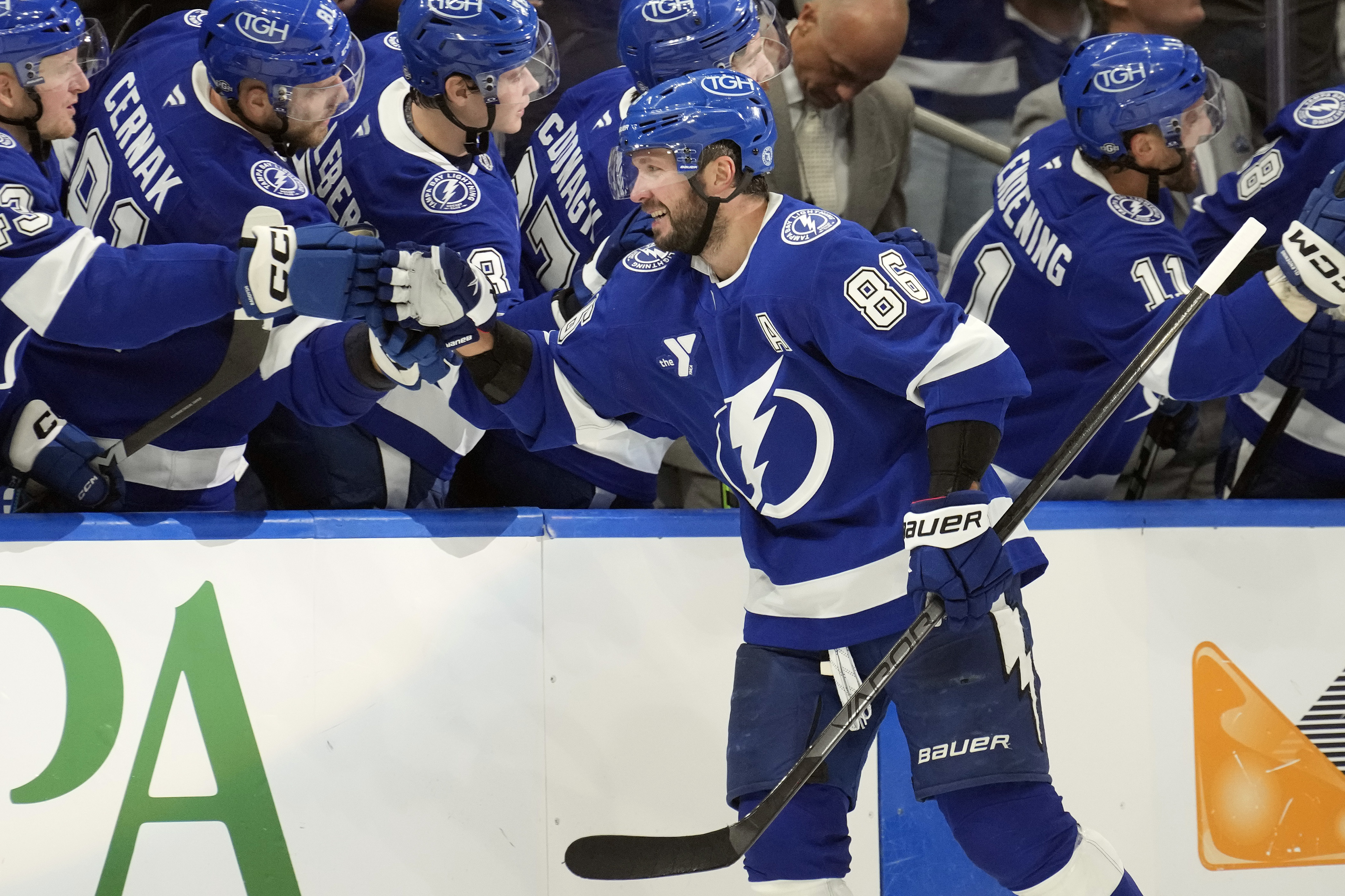 Tampa Bay Lightning right wing Nikita Kucherov (86) celebrates with the bench after scoring against the Vegas Golden Knights during the third period of an NHL hockey game Thursday, Oct. 17, 2024, in Tampa, Fla.