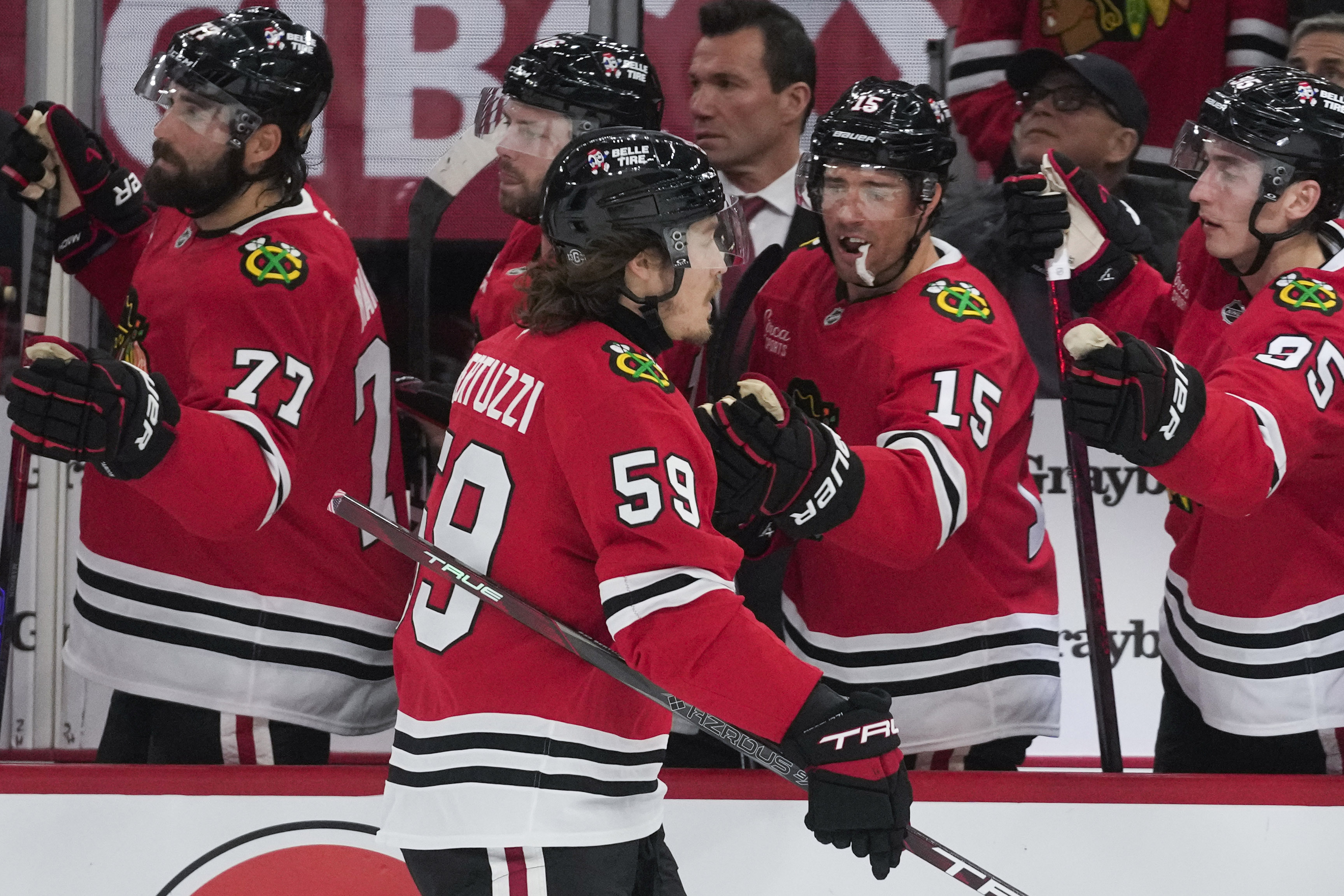 Bertuzzi helps Chicago beat San Jose 4-2 in the Blackhawks' home opener