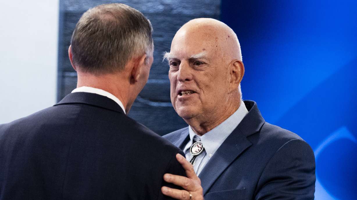 Republican state Sen. Mike Kennedy and Glenn Wright, his Democratic opponent, shake hands after the Utah Debate Commission’s debate for Congressional District 3 at the Brigham Young University Broadcasting Building in Provo on Thursday.
