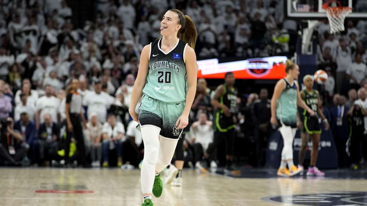 New York Liberty guard Sabrina Ionescu celebrates after making a 3-point basket during the second half against the Minnesota Lynx in Game 3 of a WNBA basketball final playoff series, Wednesday, Oct. 16, 2024, in Minneapolis. The Liberty won 80-77.