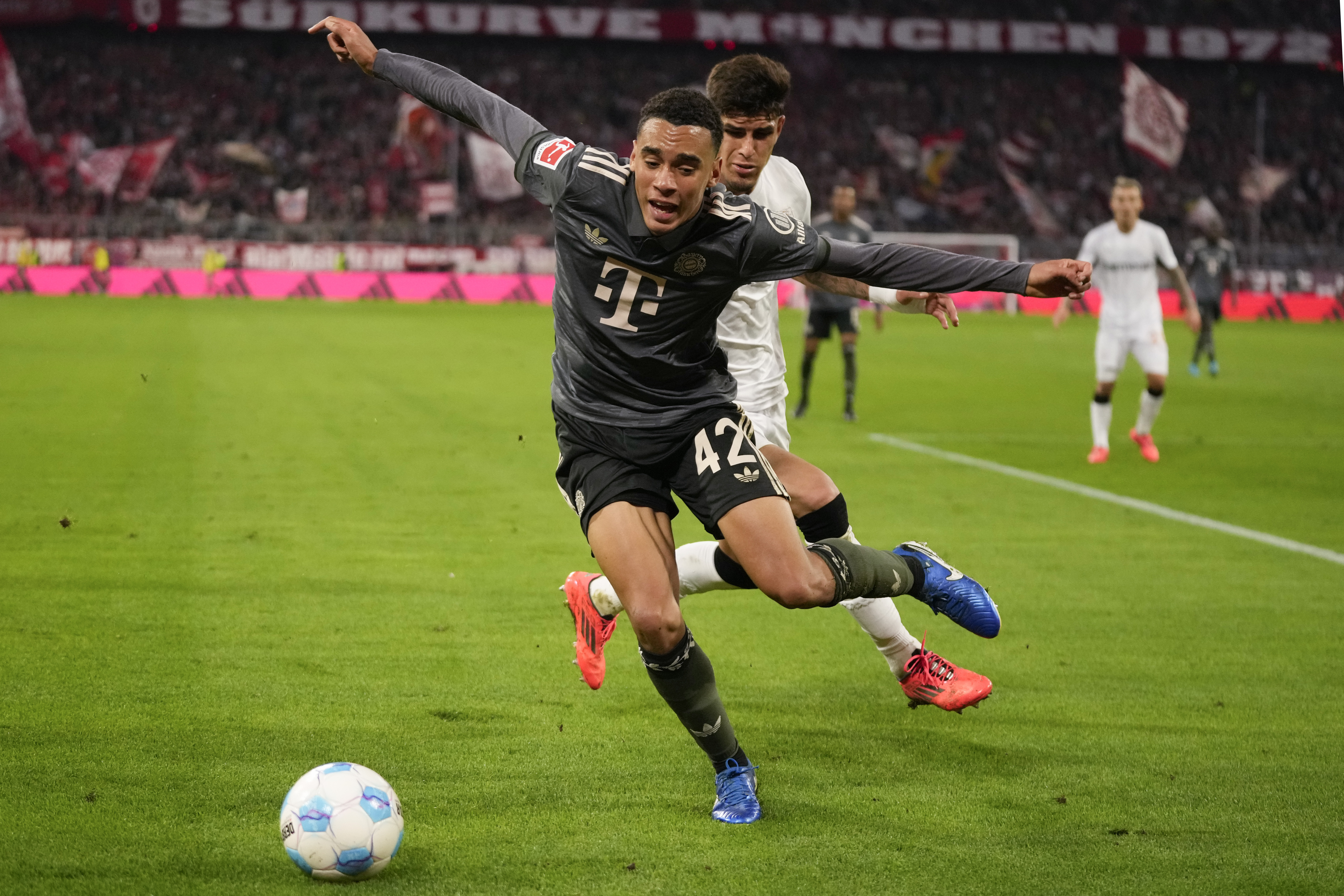 FILE - Bayern's Jamal Musiala, left, and Leverkusen's Piero Hincapie vie for the ball during the Bundesliga soccer match between Bayern Munich and Leverkusen at the Allianz Arena in Munich, Germany, Saturday, Sept. 28, 2024. 