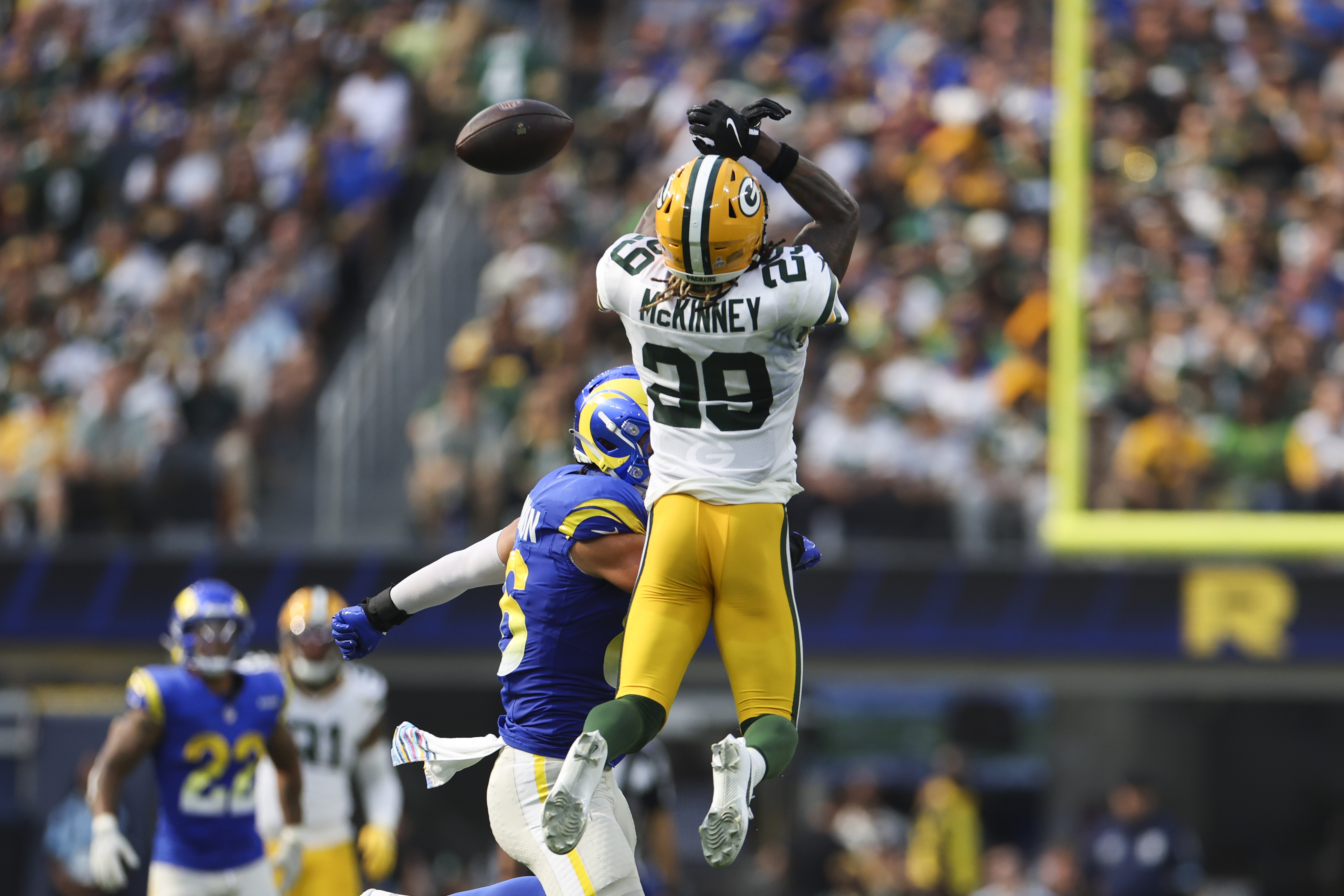Green Bay Packers safety Xavier McKinney (29) attempts to intercept a pass during the second half of an NFL football game against the Los Angeles Rams Sunday, Oct. 6, 2024, in Inglewood, Calif. 