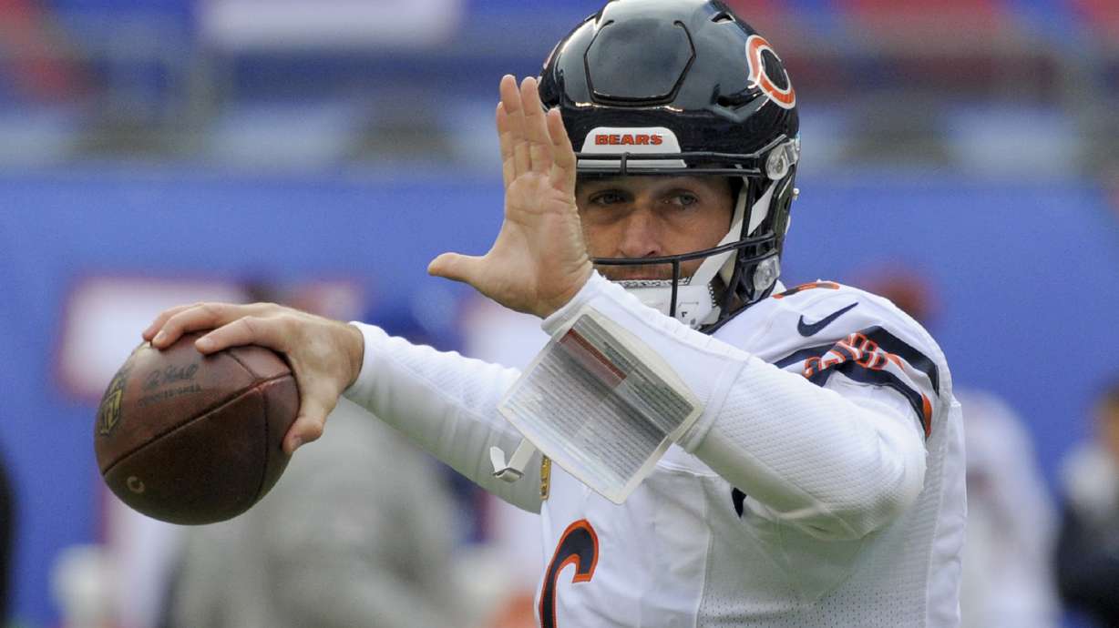 FILE - Chicago Bears quarterback Jay Cutler (6) warms up before playing against the New York Giants in an NFL football game in East Rutherford, N.J., Nov. 20, 2016.