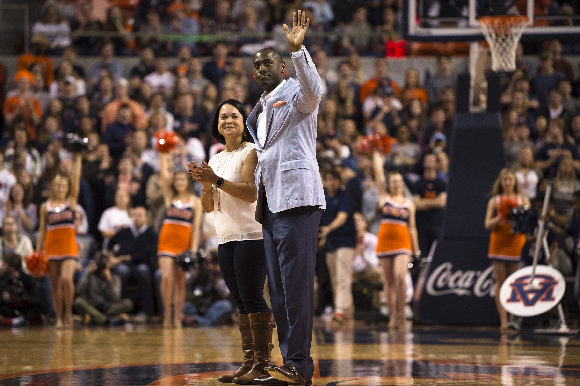 FILE - Allen Greene, Auburn Athletic Director, waives as his wife, Christy, and he are introduced during the first half of an NCAA college basketball game, Jan. 20, 2018, in Auburn, Ala. 