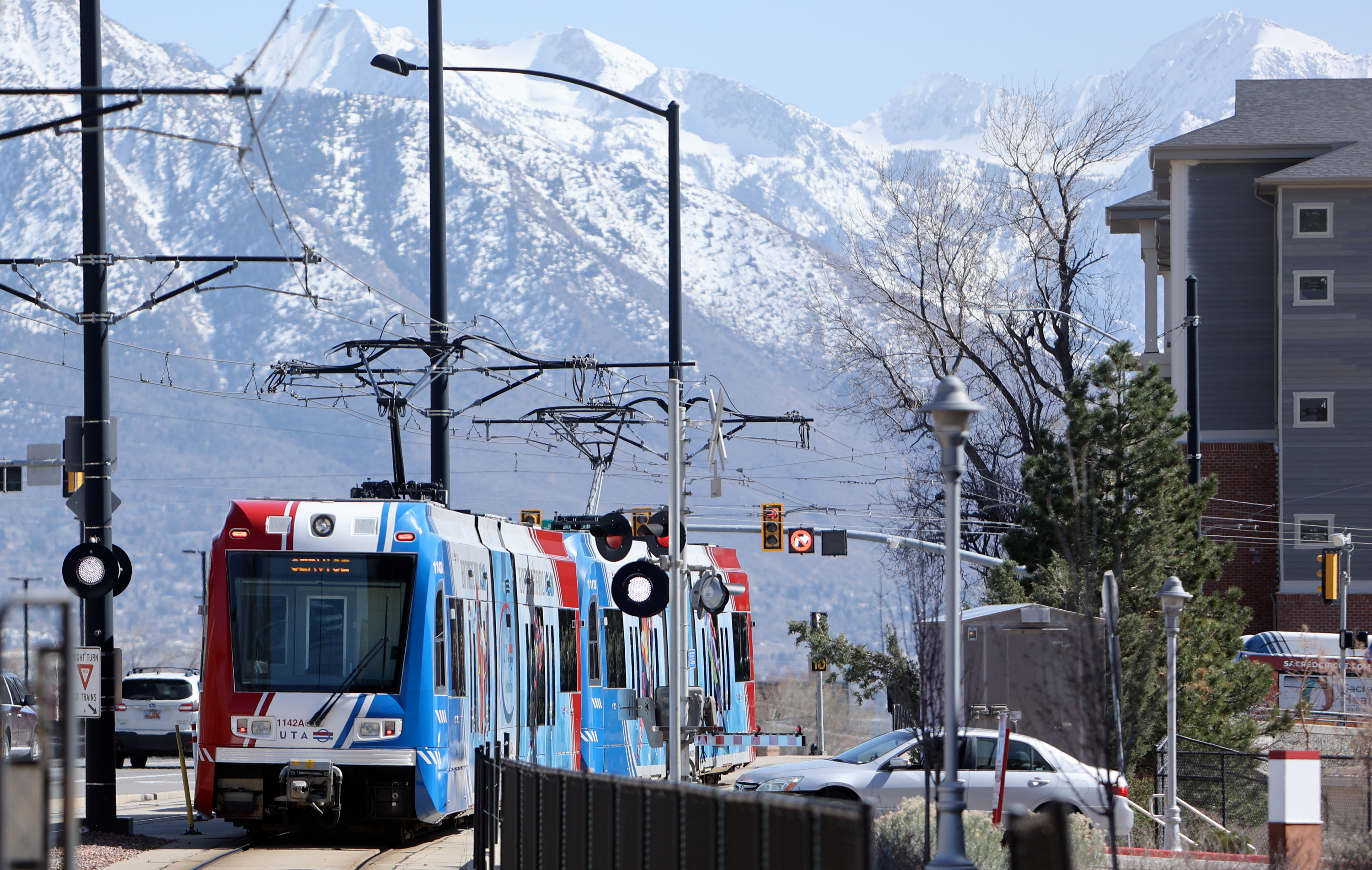 A TRAX train displays an Olympic-themed wrap as it travels through Salt Lake City on April 10.