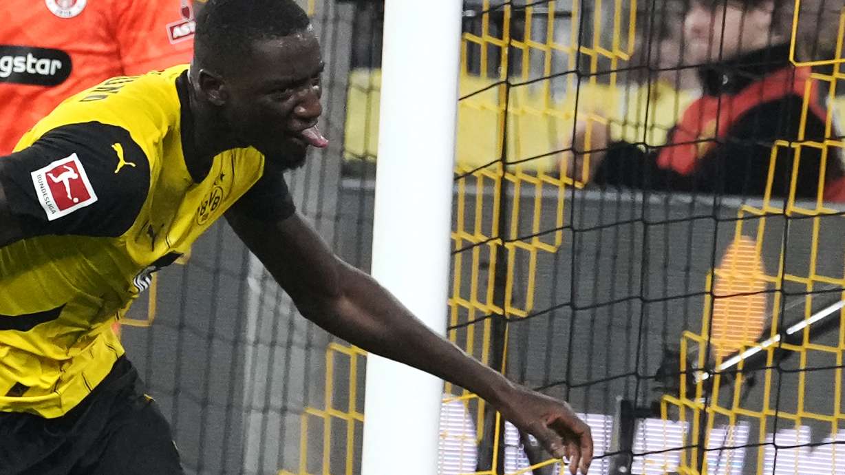 Dortmund's Serhou Yadaly Guirassy celebrates after scoring his side's second goal during the German Bundesliga soccer match between Borussia Dortmund and St. Pauli at the Signal-Iduna Park in Dortmund, Germany, Friday, Oct. 18, 2024.