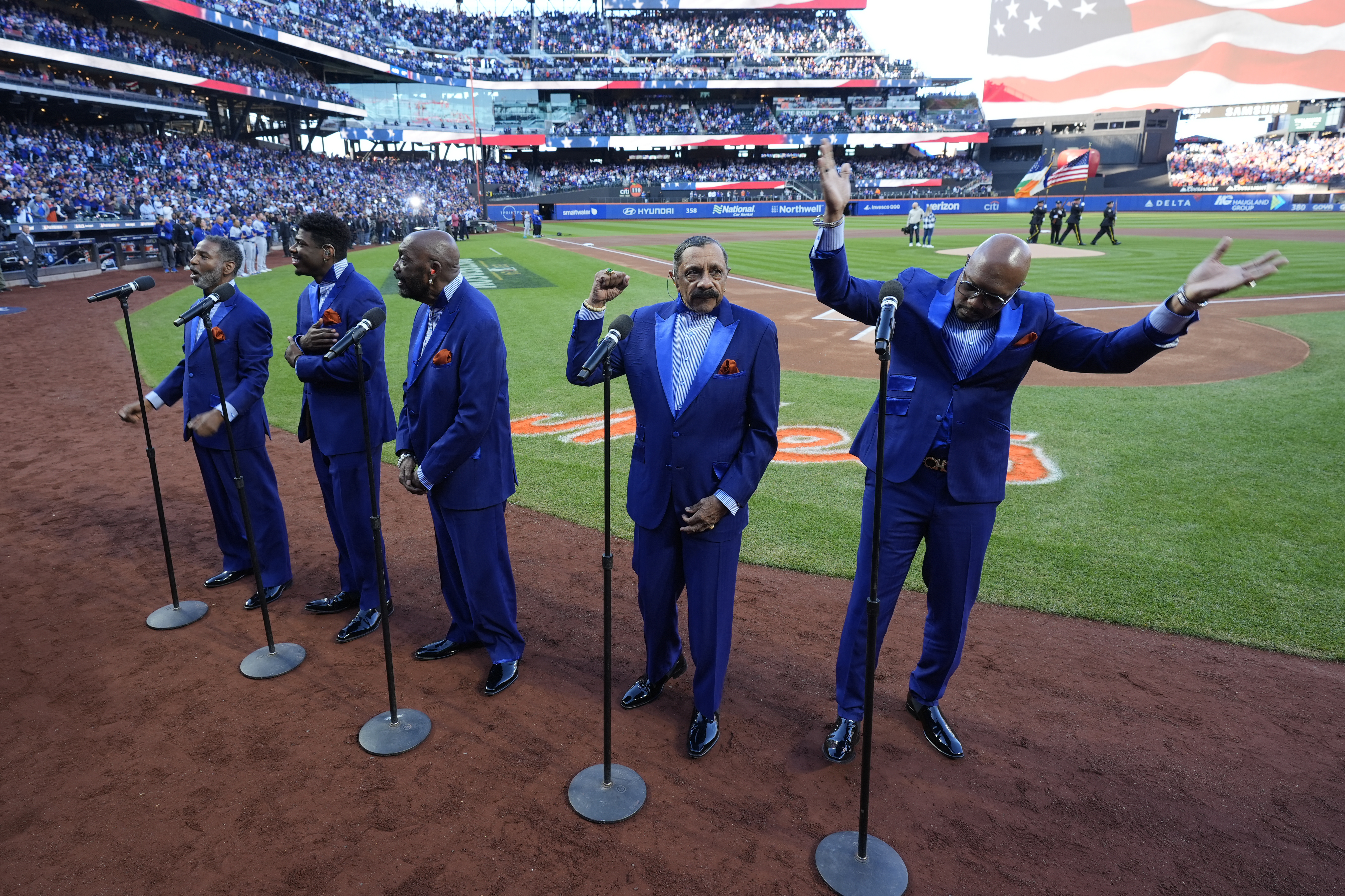The Temptations perform before Game 5 of a baseball NL Championship Series between the Los Angeles Dodgers and the New York Mets, Friday, Oct. 18, 2024, in New York.
