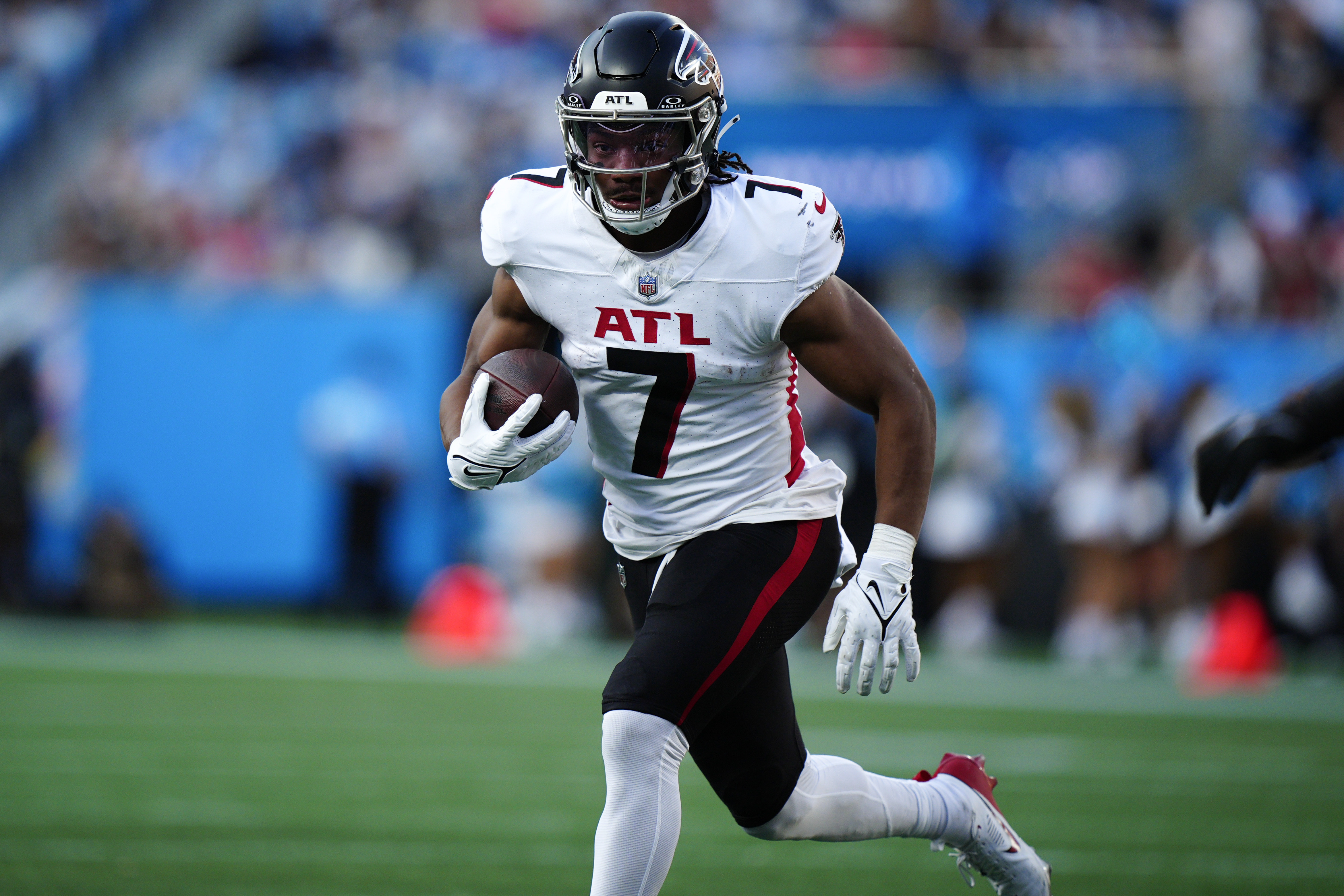 Atlanta Falcons running back Bijan Robinson (7) runs the ball in the first half of an NFL football game against the Carolina Panthers in Charlotte, N.C., Sunday, Oct. 13, 2024. 