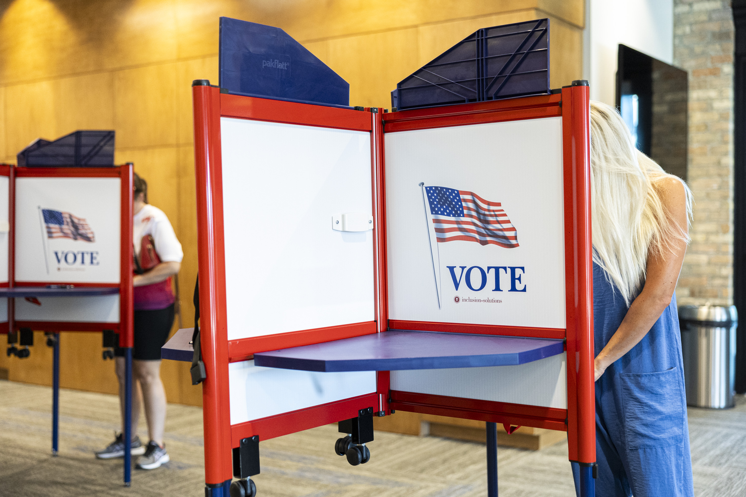 Voters fill out their ballots during primary election voting held at the Lehi Public Safety Building in Lehi on June 25. The U.S. Attorney's Office for the District of Utah announced a district election officer to oversee election-related complaints.