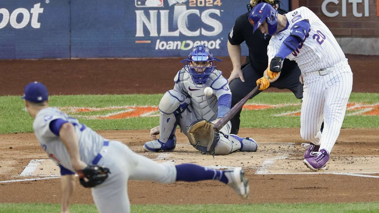 New York Mets' Pete Alonso hits a three-run home run against the Los Angeles Dodgers during the first inning in Game 5 of a baseball NL Championship Series, Friday, Oct. 18, 2024, in New York.