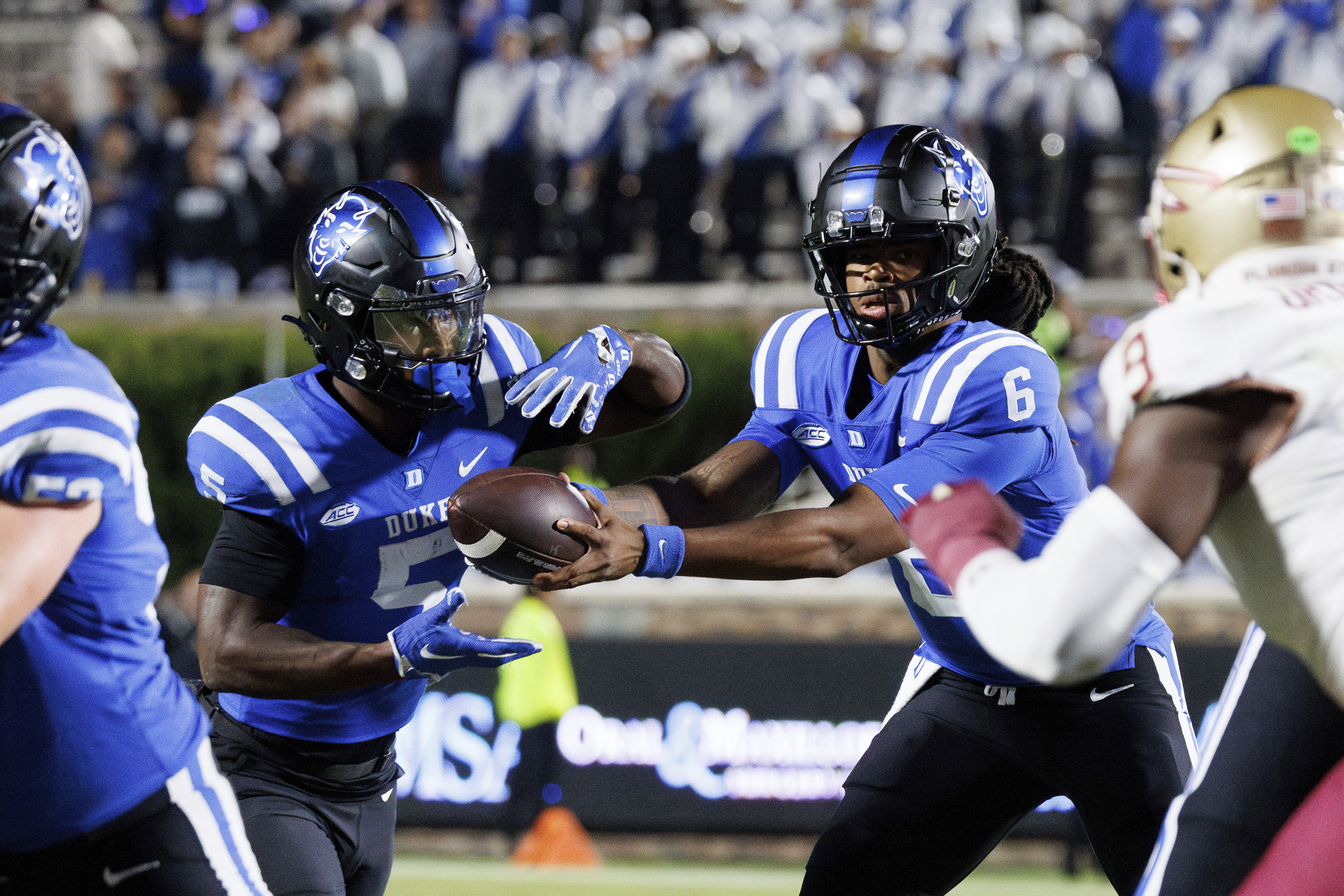 Duke quarterback Maalik Murphy (6) hands odd the ball to Peyton Jones (5) during the first half of an NCAA college football game against Florida State in Durham, N.C., Friday, Oct. 18, 2024. 