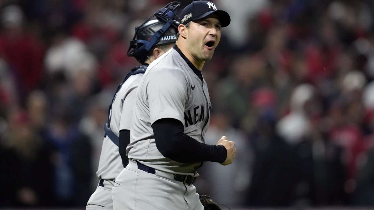 New York Yankees pitcher Tommy Kahnle celebrates after Game 4 of the baseball AL Championship Series against the Cleveland Guardians Friday, Oct. 18, 2024, in Cleveland. The Yankees won 8-6 to take a 3-1 lead in the best-of-seven series.