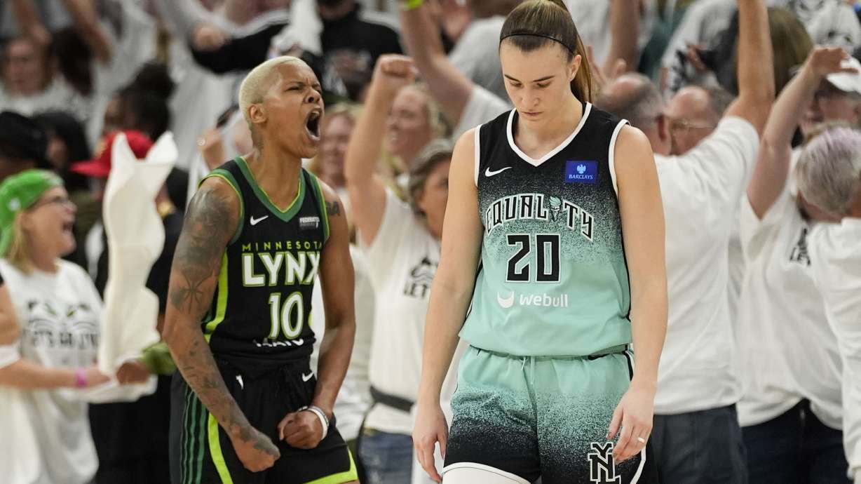 New York Liberty guard Sabrina Ionescu (20) reacts after missing a shot at the buzzer, as Minnesota Lynx guard Courtney Williams (10) celebrates during the second half of Game 4 of a WNBA basketball final playoff series, Friday, Oct. 18, 2024, in Minneapolis. The Lynx won 82-80, forcing a Game 5 in the series.
