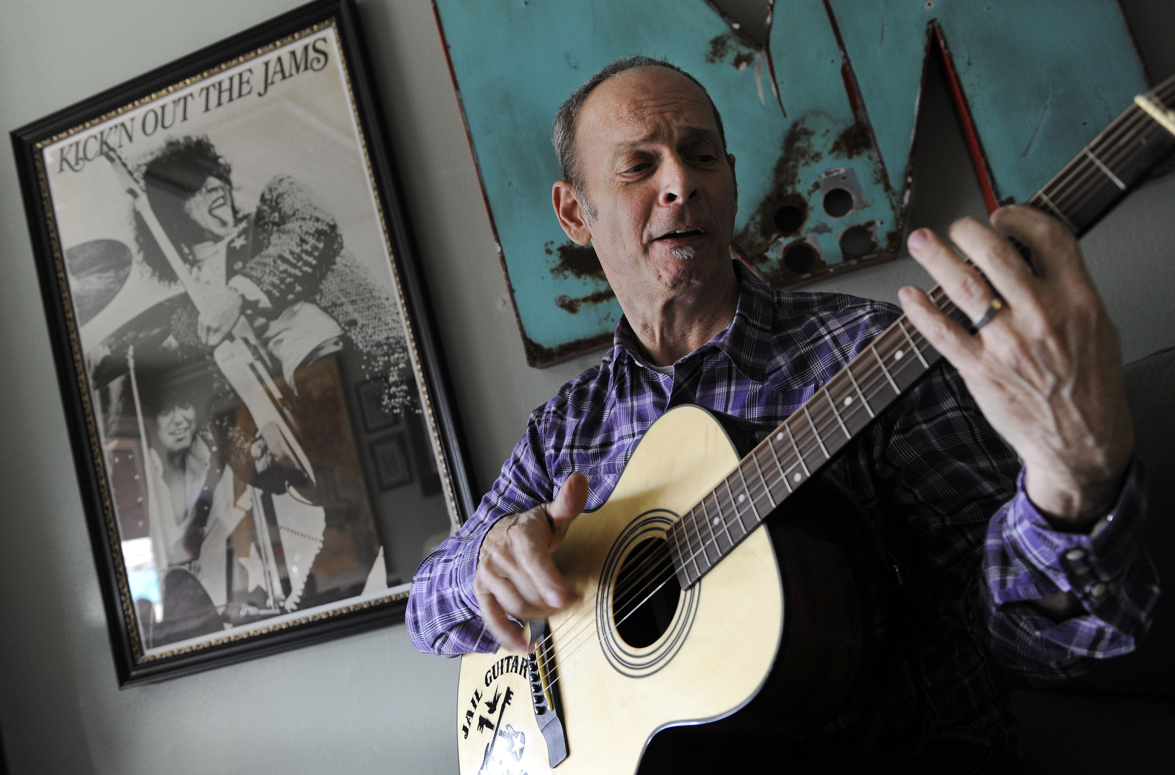 Wayne Kramer, co-founder of the protopunk Detroit band the MC5, plays a guitar at his recording studio in Los Angeles on Jan. 16, 2012. 