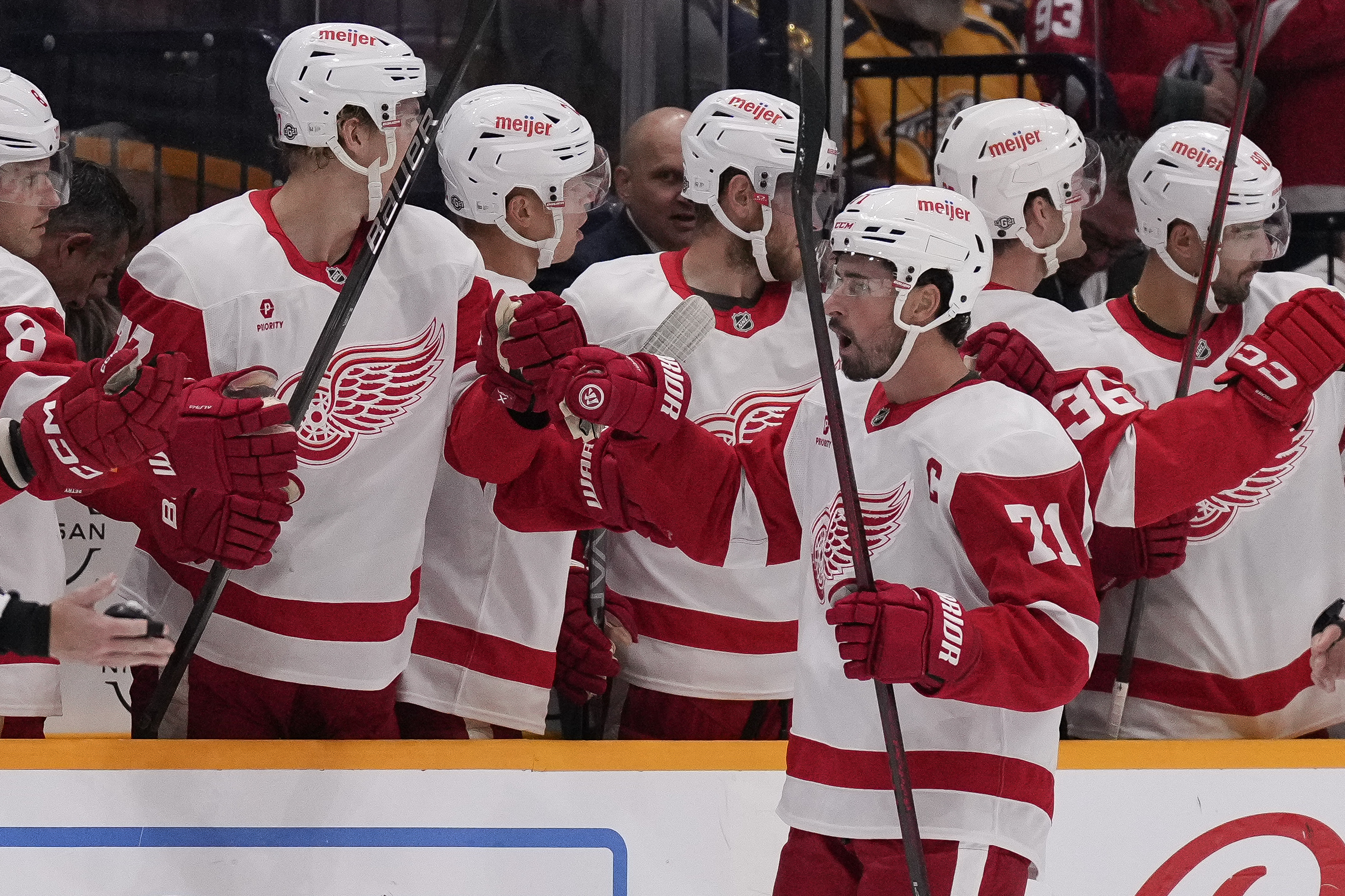 Detroit Red Wings center Dylan Larkin (71) celebrates his goal with teammates during the second period of an NHL hockey game against the Nashville Predators, Saturday, Oct. 19, 2024, in Nashville, Tenn.
