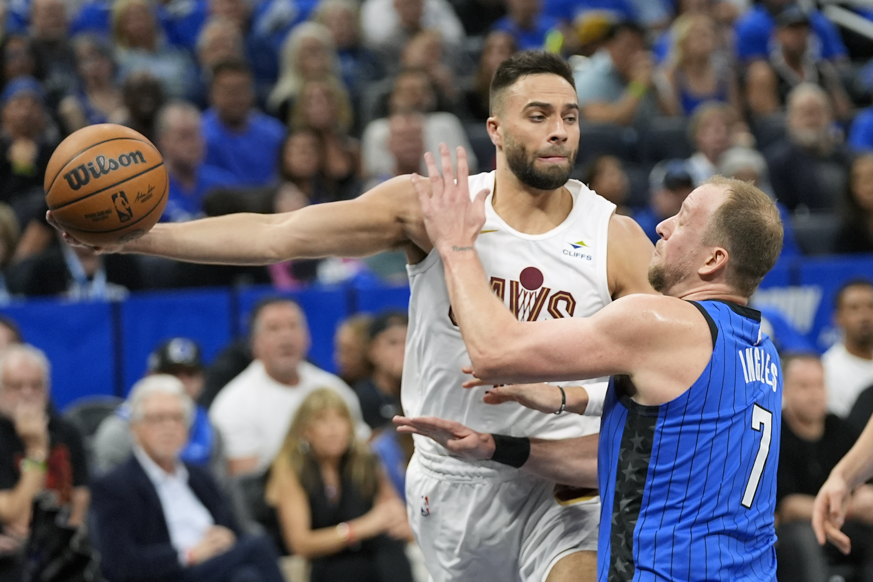 FILE - Cleveland Cavaliers guard Max Strus, left, passes the ball around Orlando Magic guard Joe Ingles (7) during the first half of Game 6 of an NBA basketball first-round playoff series, May 3, 2024, in Orlando, Fla. 