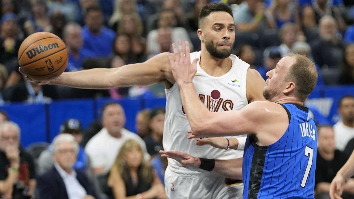 FILE - Cleveland Cavaliers guard Max Strus, left, passes the ball around Orlando Magic guard Joe Ingles (7) during the first half of Game 6 of an NBA basketball first-round playoff series, May 3, 2024, in Orlando, Fla.