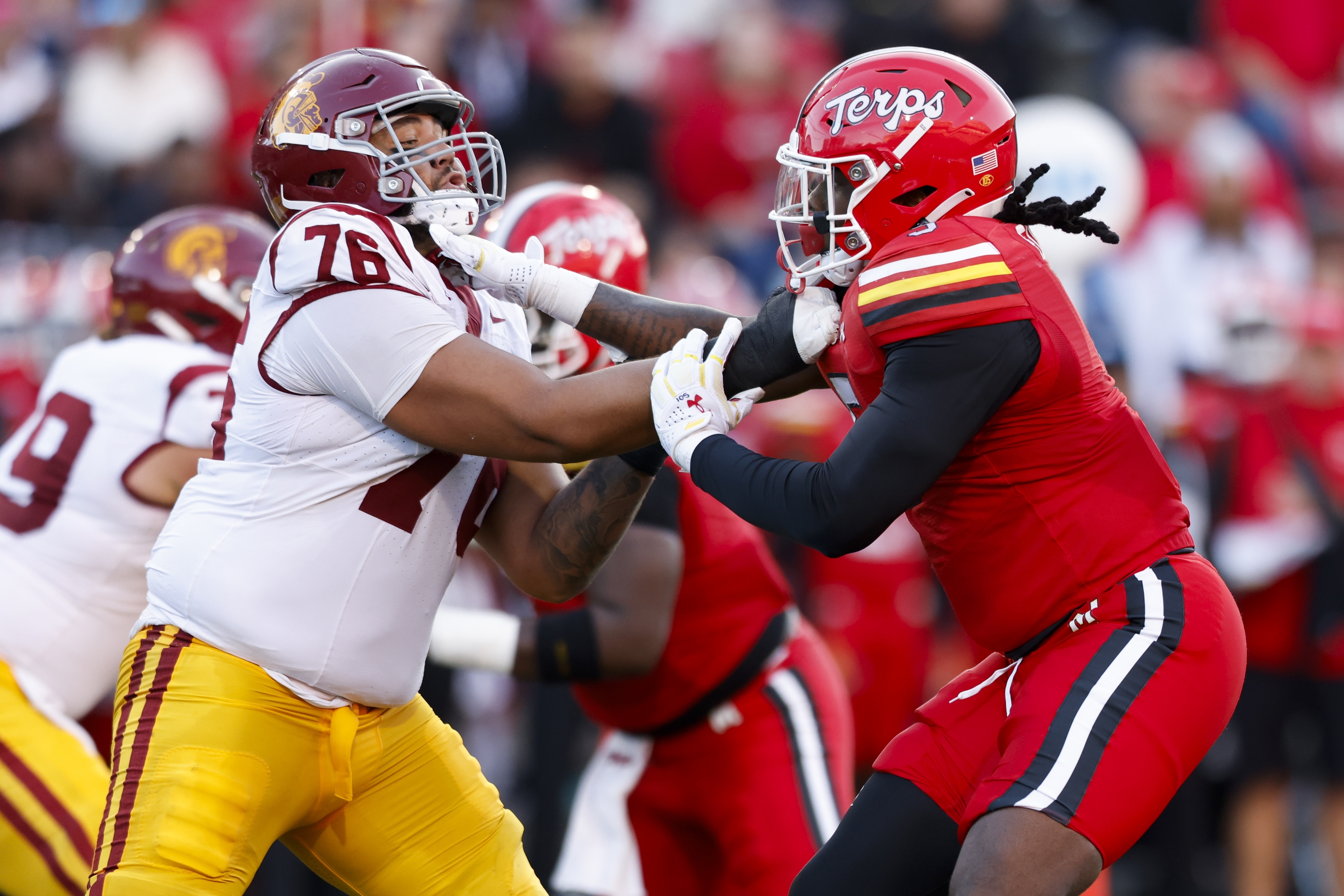 Maryland defensive lineman Quashon Fuller, right, defends against Southern California offensive lineman Mason Murphy (76) during the first half of an NCAA college football game, Saturday, Oct. 19, 2024, in College Park, Md.