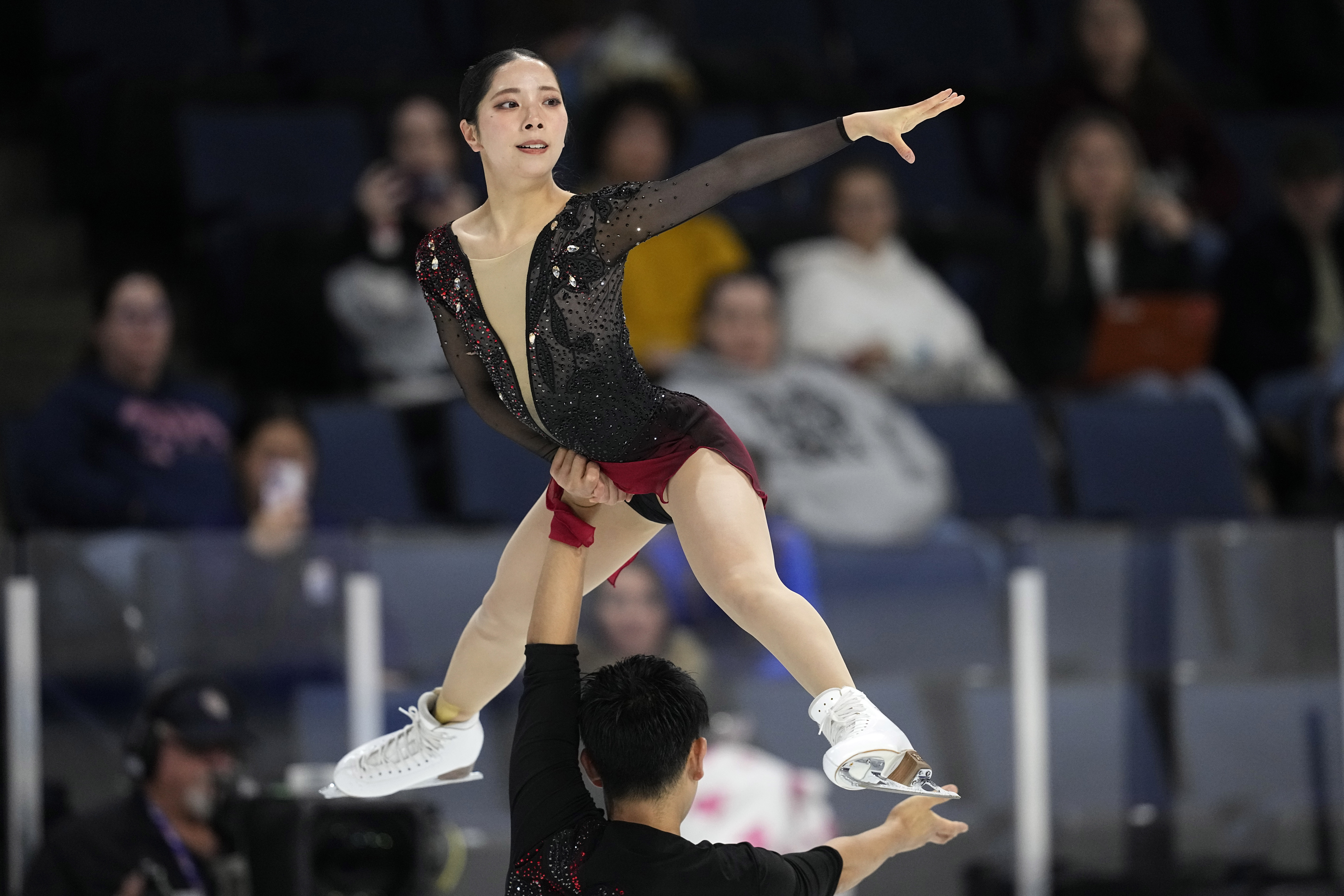 Riku Miura and Ryuichi Kihara of Japan compete during the pairs free skate program at the Skate America figure skating event in Allen, Texas, Saturday, Oct. 19, 2024. 