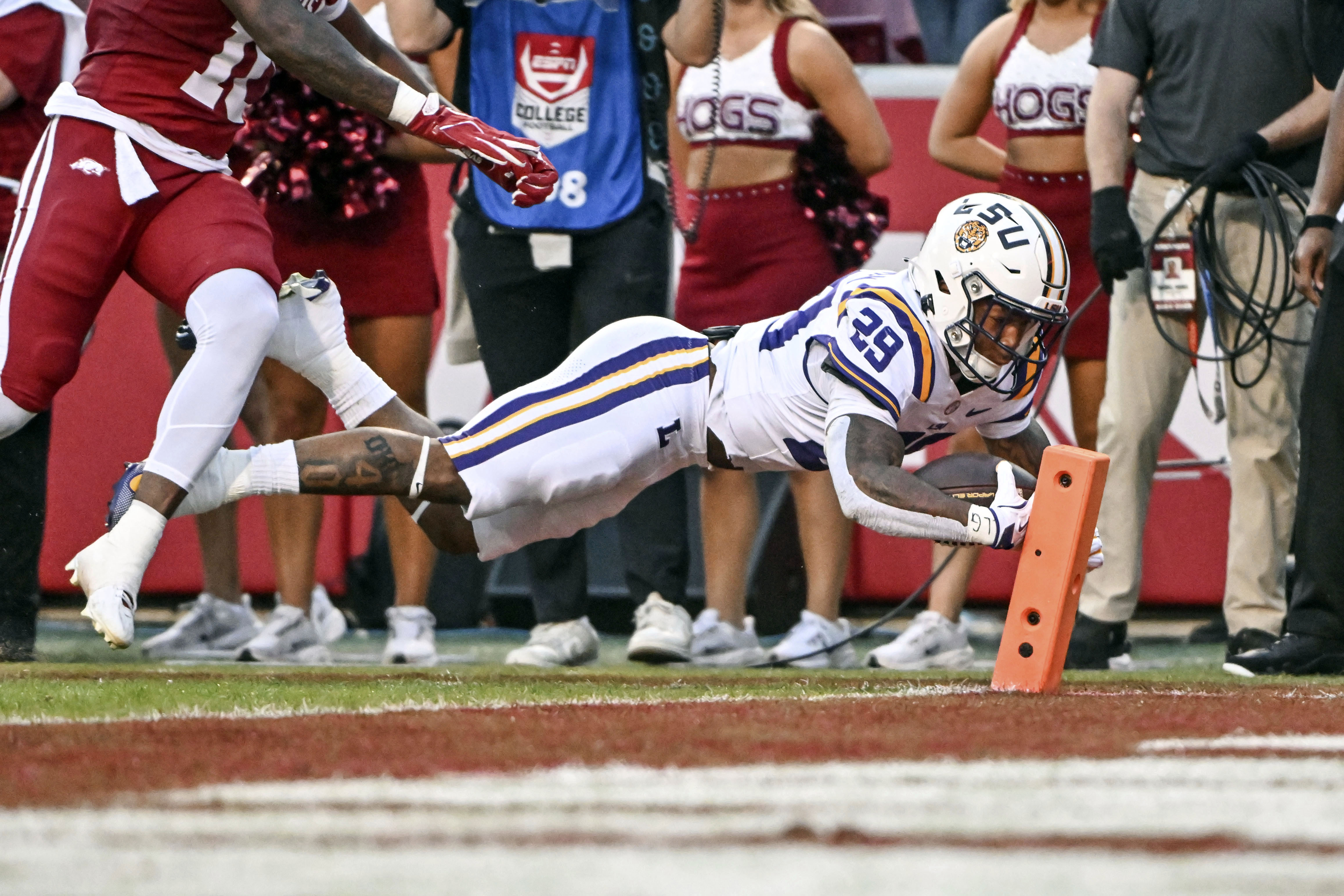 LSU running back Caden Durham (29) dives into the end zone for a touchdown against Arkansas during the first half of an NCAA college football game Saturday, Oct. 19, 2024, in Fayetteville, Ark.