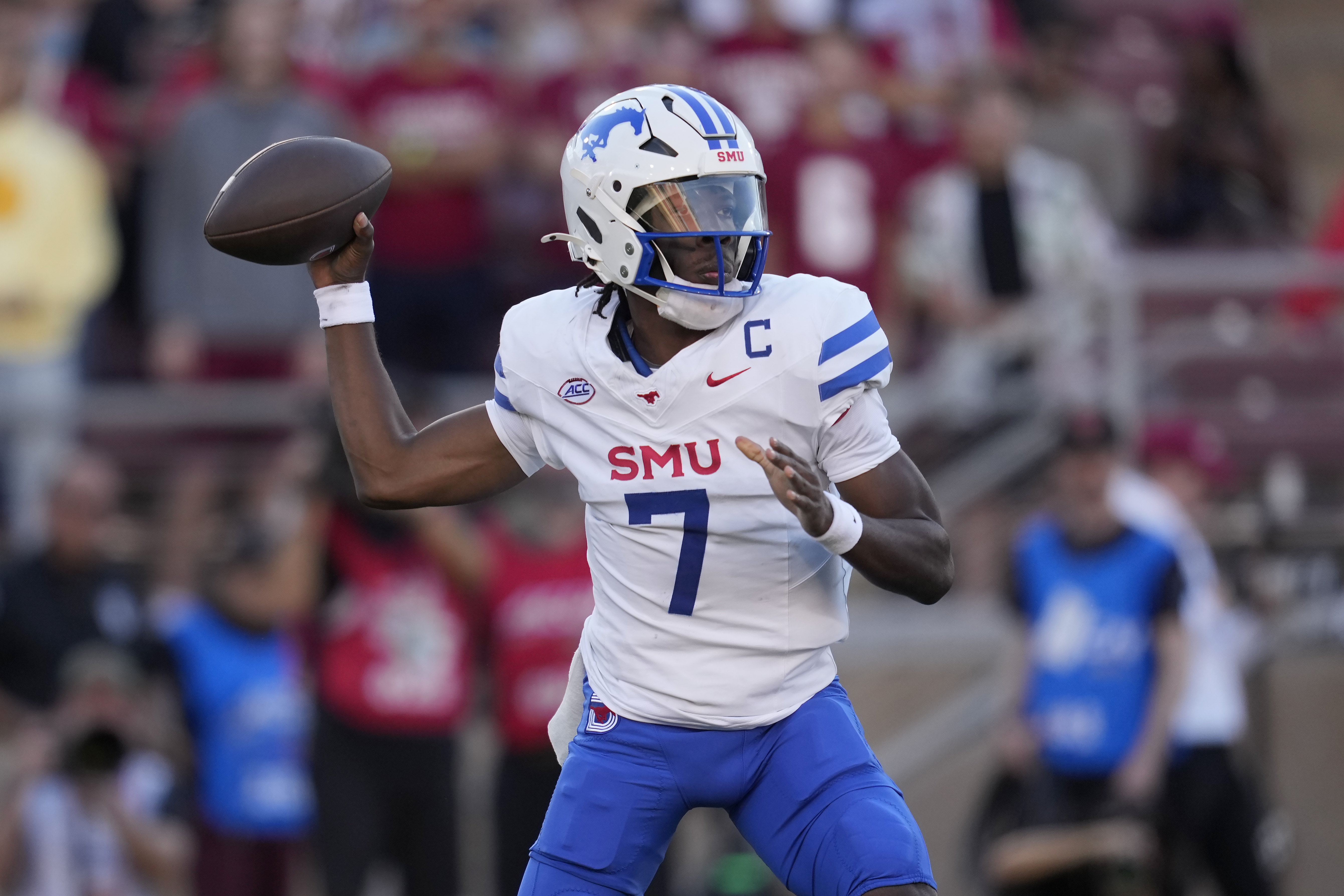 SMU quarterback Kevin Jennings throws a touchdown pass to wide receiver Moochie Dixon against Stanford during the first half of an NCAA college football game in Stanford, Calif., Saturday, Oct. 19, 2024. 