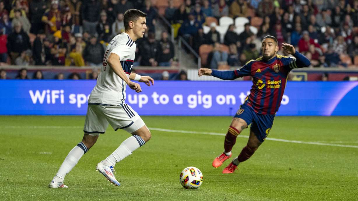 Vancouver Whitecaps' defender, Ranko Veselinovic, left, controls the ball while Real Salt Lake's Cristian Arango, right, attempts to regain possession during the first half of an MLS soccer game on Saturday, Oct. 19, 2024 in Salt Lake City.