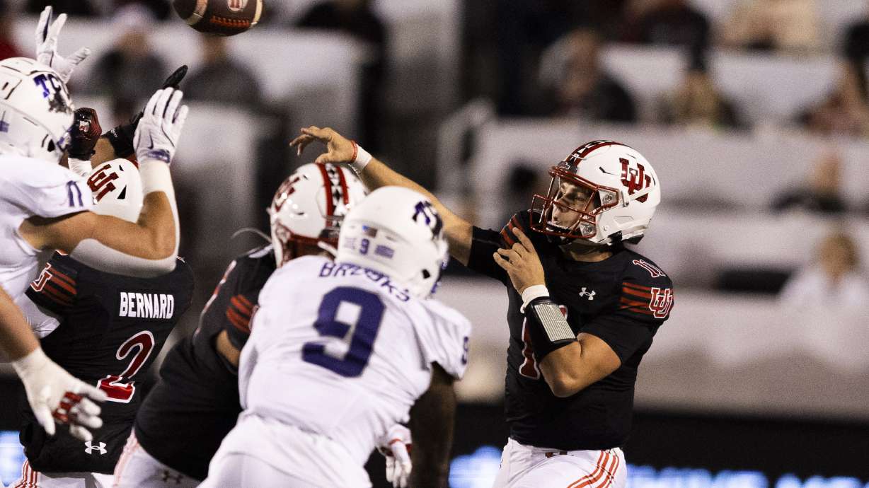 Utah Utes quarterback Isaac Wilson (11) throws a pass during a game between the University of Utah and the TCU Horned Frogs at Rice-Eccles Stadium in Salt Lake City on Saturday, Oct. 19, 2024.