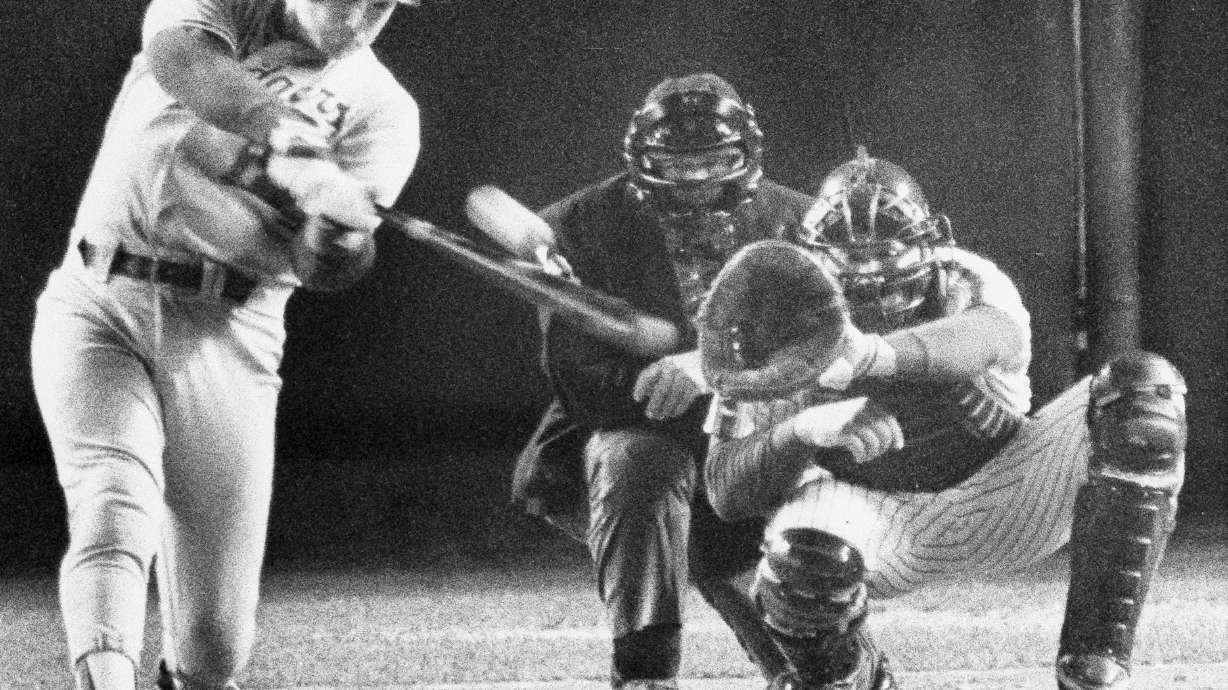 FILE - Los Angeles Dodgers batter Mike Scioscia hits a two-run homer as New York Mets catcher Gary Carter and umpire Dutch Rennert look on, during Game 4 of the National League Championship Series in New York, Oct. 9, 1988.