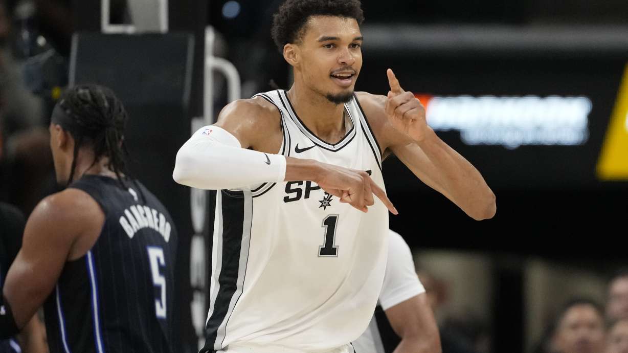 San Antonio Spurs center Victor Wembanyama (1) reacts to a score against the Orlando Magic during the first half of a preseason NBA basketball game in San Antonio, Wednesday, Oct. 9, 2024.