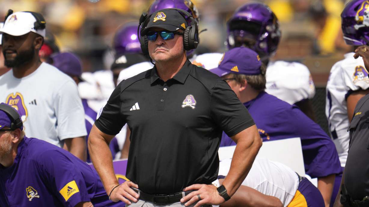 FILE - East Carolina head coach Mike Houston watches against Michigan in the second half of an NCAA college football game in Ann Arbor, Mich., Saturday, Sept. 2, 2023.